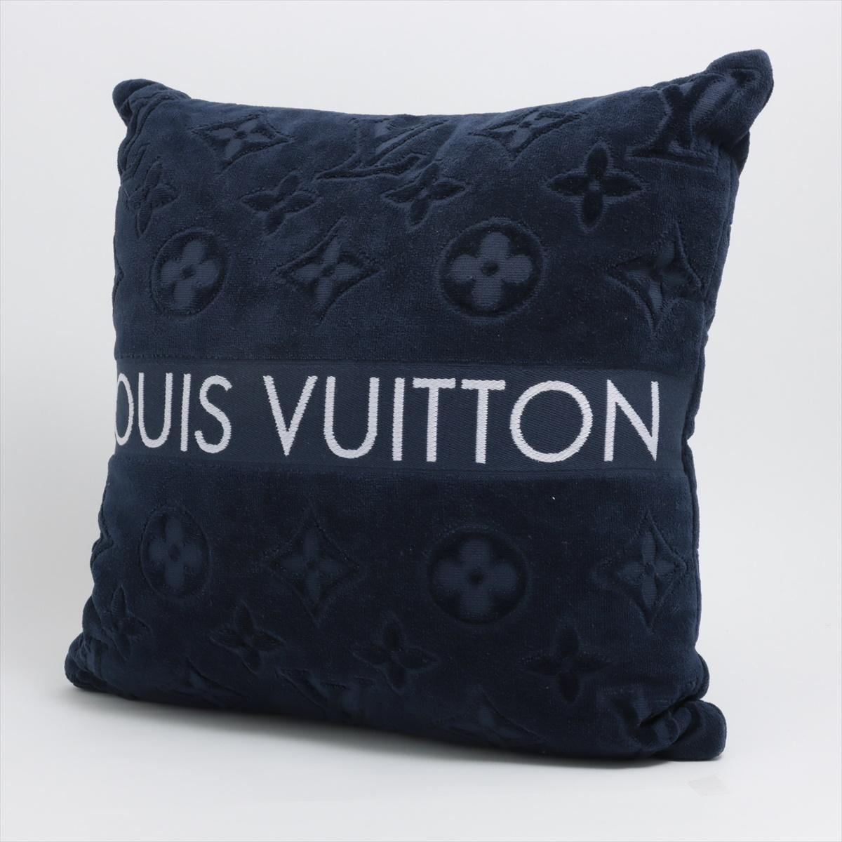 The Louis Vuitton LVacation Beach Pillow in yellow is a stylish and functional accessory perfect for luxurious relaxation. The elegant beach pillow showcases a deep navy blue hue, complemented by the iconic Louis Vuitton Monogram pattern, offering a