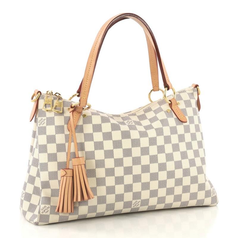 This Louis Vuitton Lymington Handbag Damier, crafted from damier azur coated canvas, features dual flat handles, fringe tassel, and gold-tone hardware. Its zip closure opens to a pink fabric interior with slip pockets. Authenticity code reads: