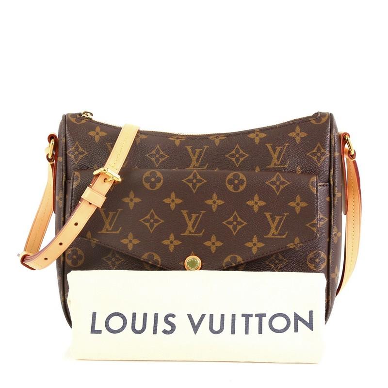 This Louis Vuitton Mabillon Shoulder Bag Monogram Canvas, crafted from brown monogram coated canvas, features an adjustable natural cowhide leather strap, exterior front snap pocket, and gold-tone hardware. Its zip closure opens to a purple fabric