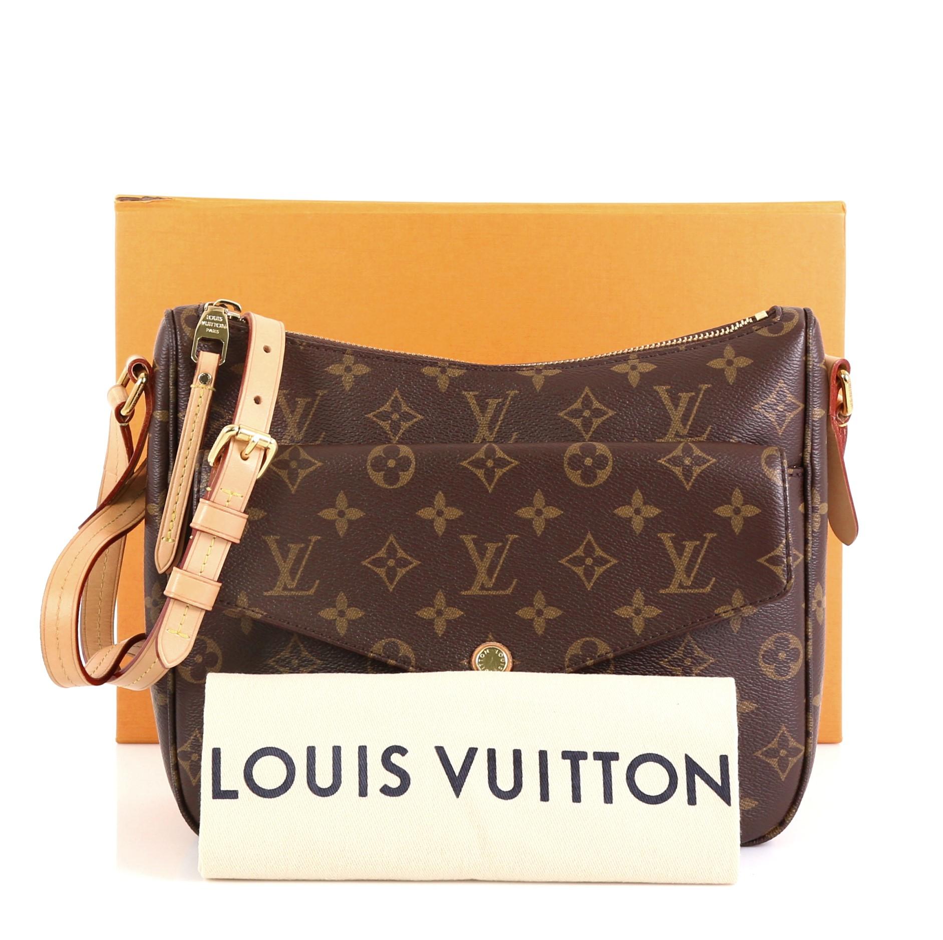 This Louis Vuitton Mabillon Shoulder Bag Monogram Canvas, crafted from brown monogram coated canvas, features an adjustable natural cowhide leather strap, exterior front snap pocket, and gold-tone hardware. Its zip closure opens to a red fabric