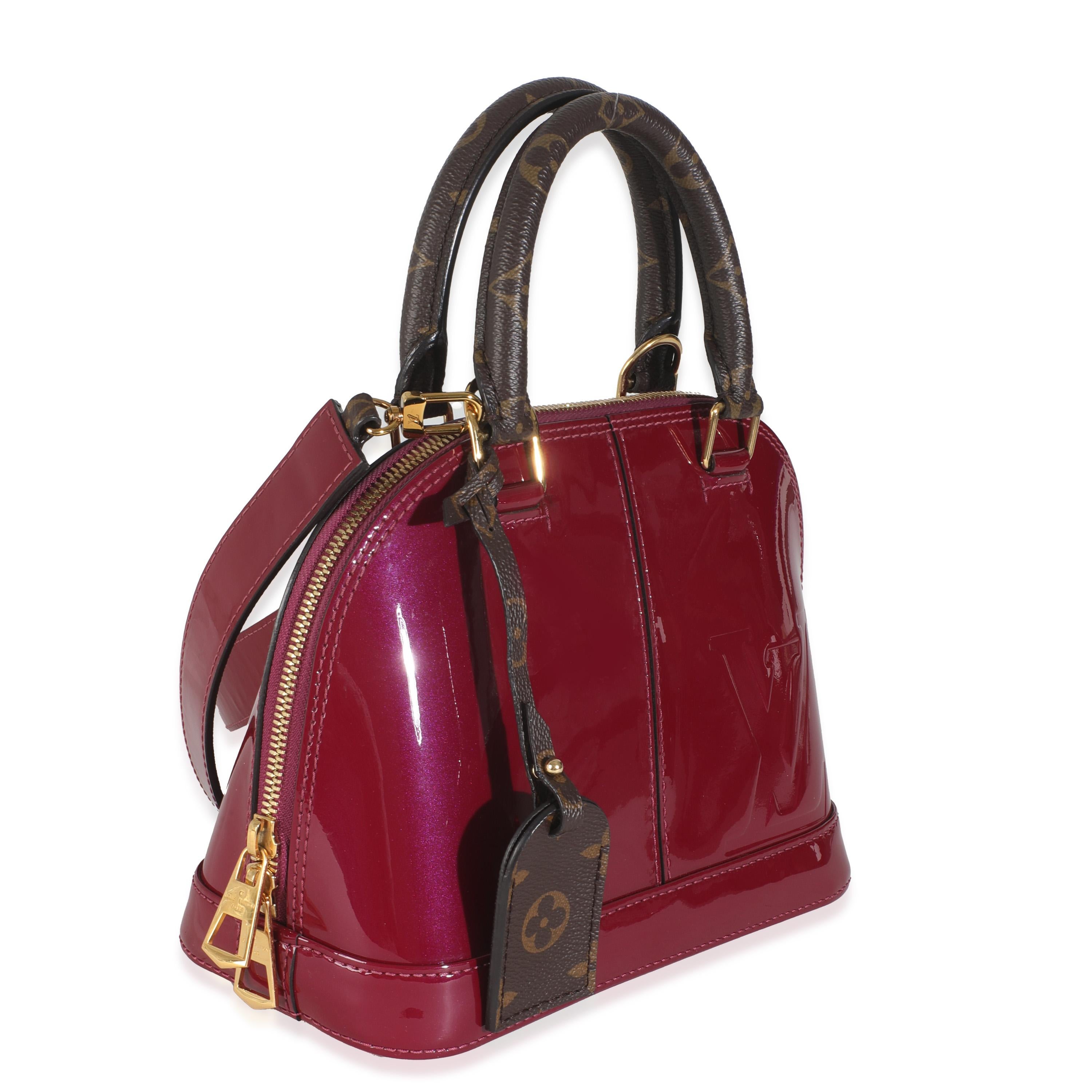 Listing Title: Louis Vuitton Magenta Monogram Vernis Alma BB
SKU: 146102
Condition: Pre-owned 
Condition Description: Introduced in 1992, the history of the Alma bag from Louis Vuitton actually goes back way further in time. The tote bag is based on