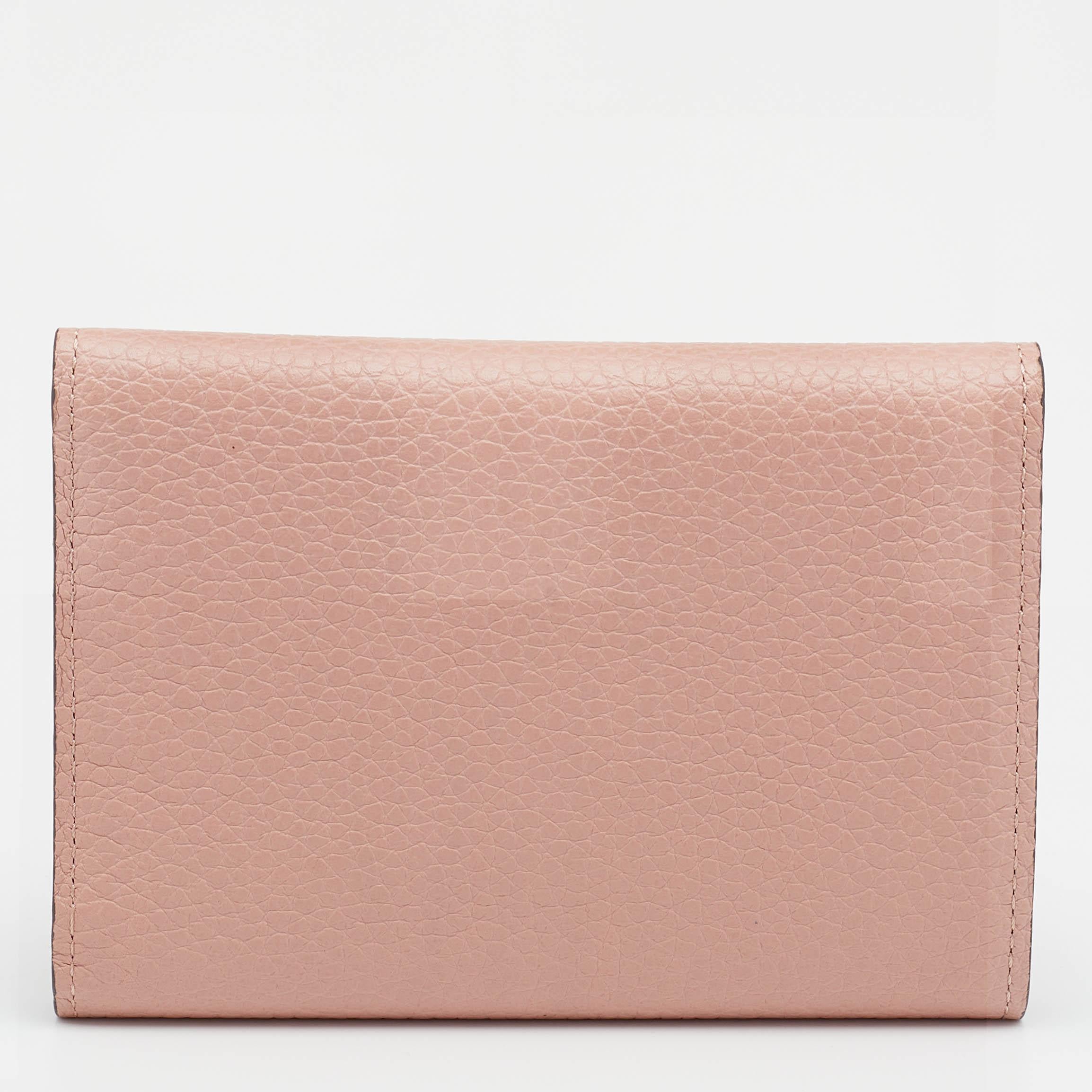 It is every woman's dream to own a Louis Vuitton creation as appealing as this one. Crafted from leather, this compact wallet features a structured design. While the front logo elevates its beauty, the well-sized interior will dutifully hold all