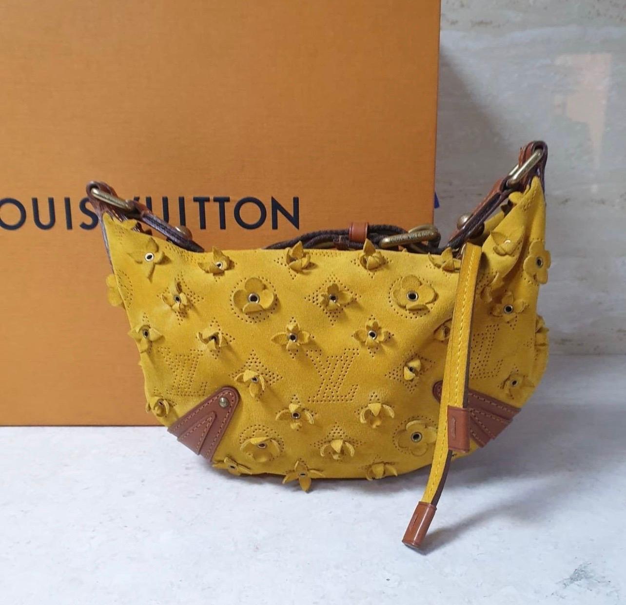 This stunning Louis Vuitton Onatah Fleurs PM bag is a rare find. Part of a limited edition line from the fashion house, this bag has been crafted from Mais monogram suede and finished with leather trims. It is secured with a top zipper closure and