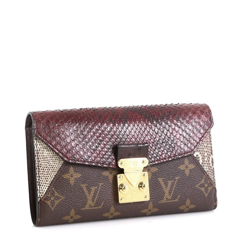 This Louis Vuitton Majestueux Wallet Monogram Canvas and Exotics, crafted in brown monogram coated canvas, genuine brown ostrich skin, and genuine python skin, features gold-tone hardware. Its S-lock and zip closure opens to a brown leather