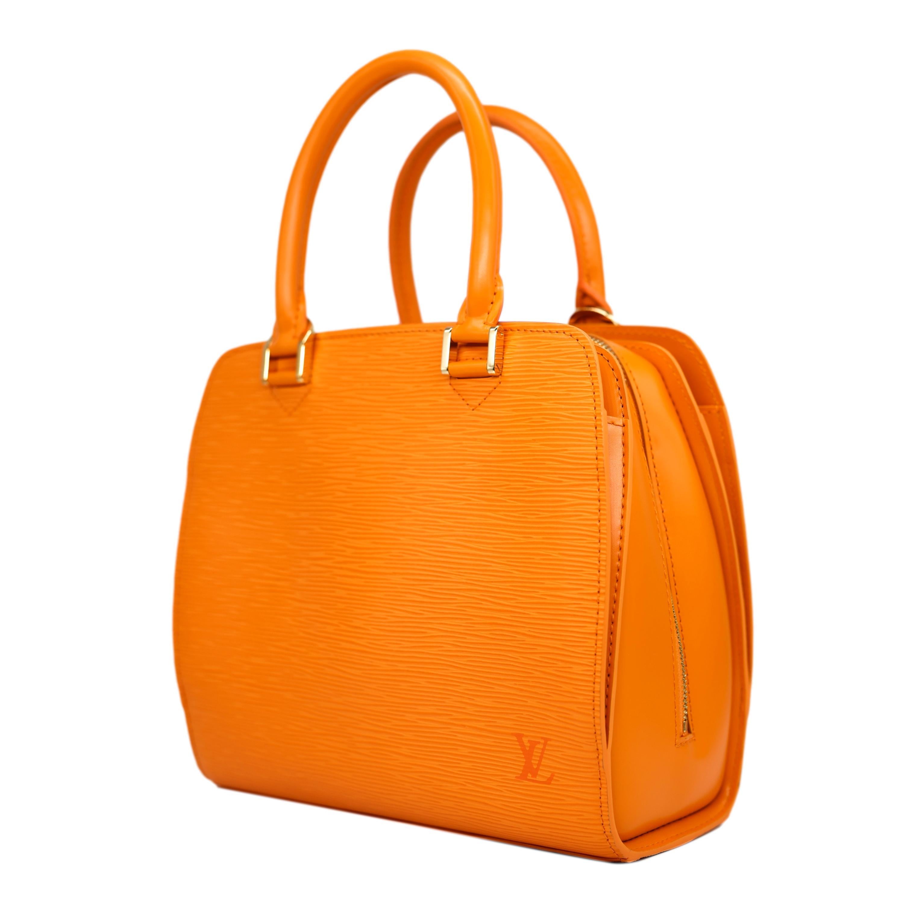 Louis Vuitton Mandarin EPI Orange Pont Neuf PM Top Handle Handbag, 2003. Made in France in November of 2003, the Pont Neuf was originally inspired by the oldest standing bridge in Paris in which Louis Vuitton designed a series of handbags inspired