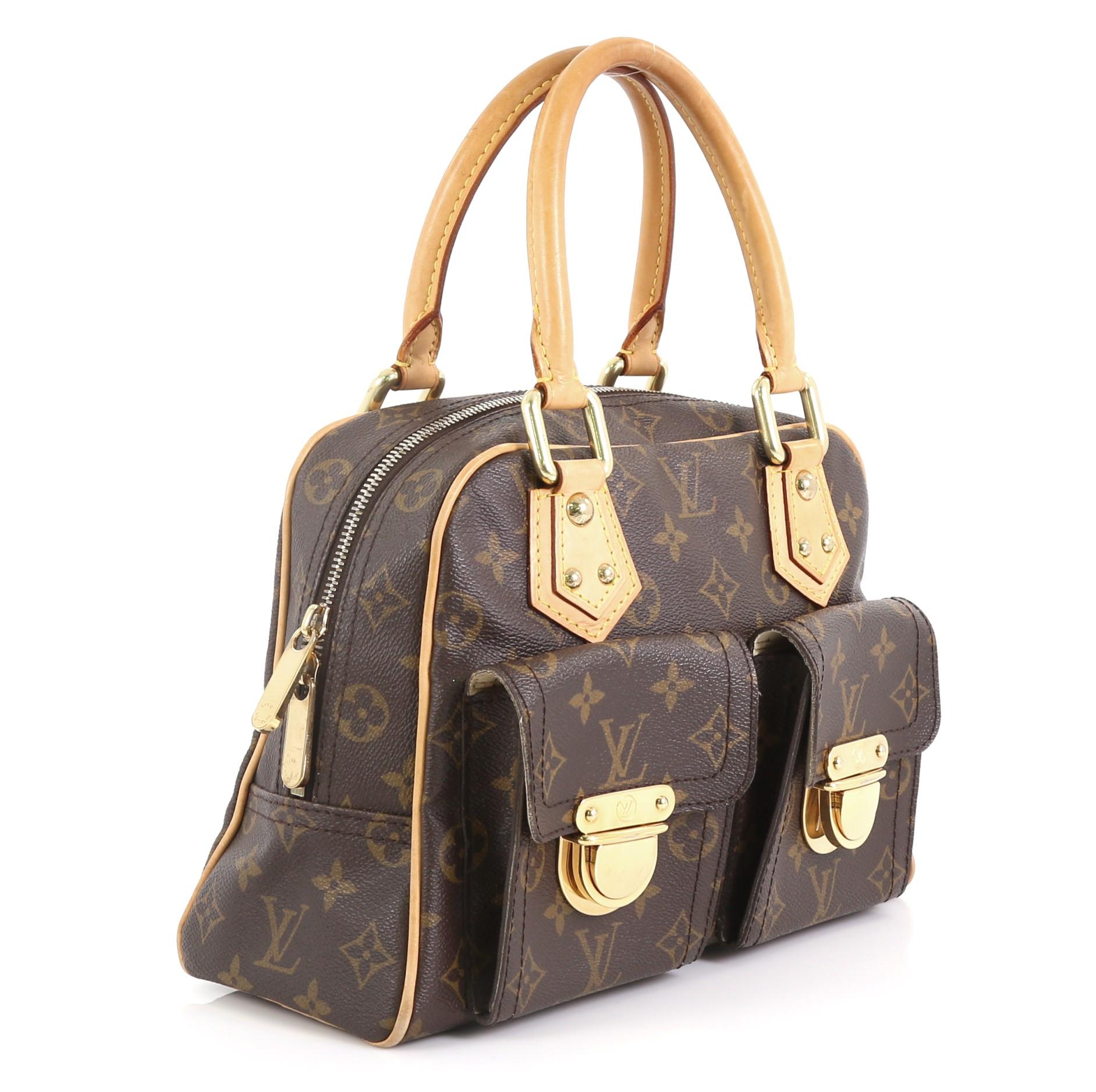 This Louis Vuitton Manhattan Handbag Monogram Canvas PM, crafted in brown monogram coated canvas, features dual rolled vachetta leather handles, front pockets with push-lock closure, and gold-tone hardware. Its zip closure opens to a neutral