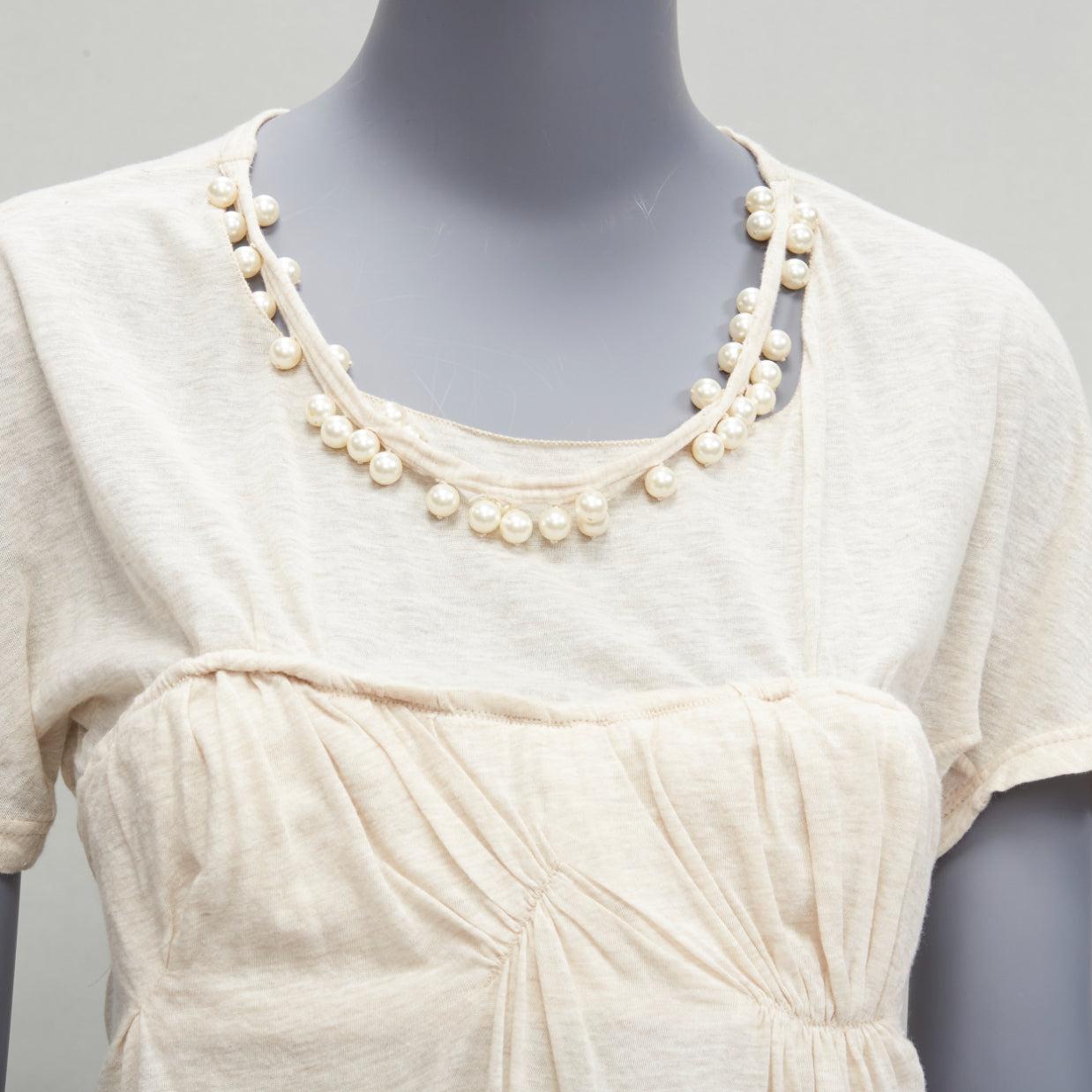 LOUIS VUITTON Marc Jacobs beige detached pearl necklace cupped bust tshirt FR38 M
Reference: VACN/A00043
Brand: Louis Vuitton
Designer: Marc Jacobs
Material: Feels like cotton
Color: Beige
Pattern: Solid
Closure: Tie Neck
Extra Details: Tie back