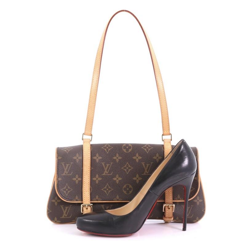 This Louis Vuitton Marelle Shoulder Bag Monogram Canvas, crafted from brown monogram coated canvas, features vachetta leather shoulder strap and gold-tone hardware. Its belt closure opens to a brown fabric interior with two compartments and a middle