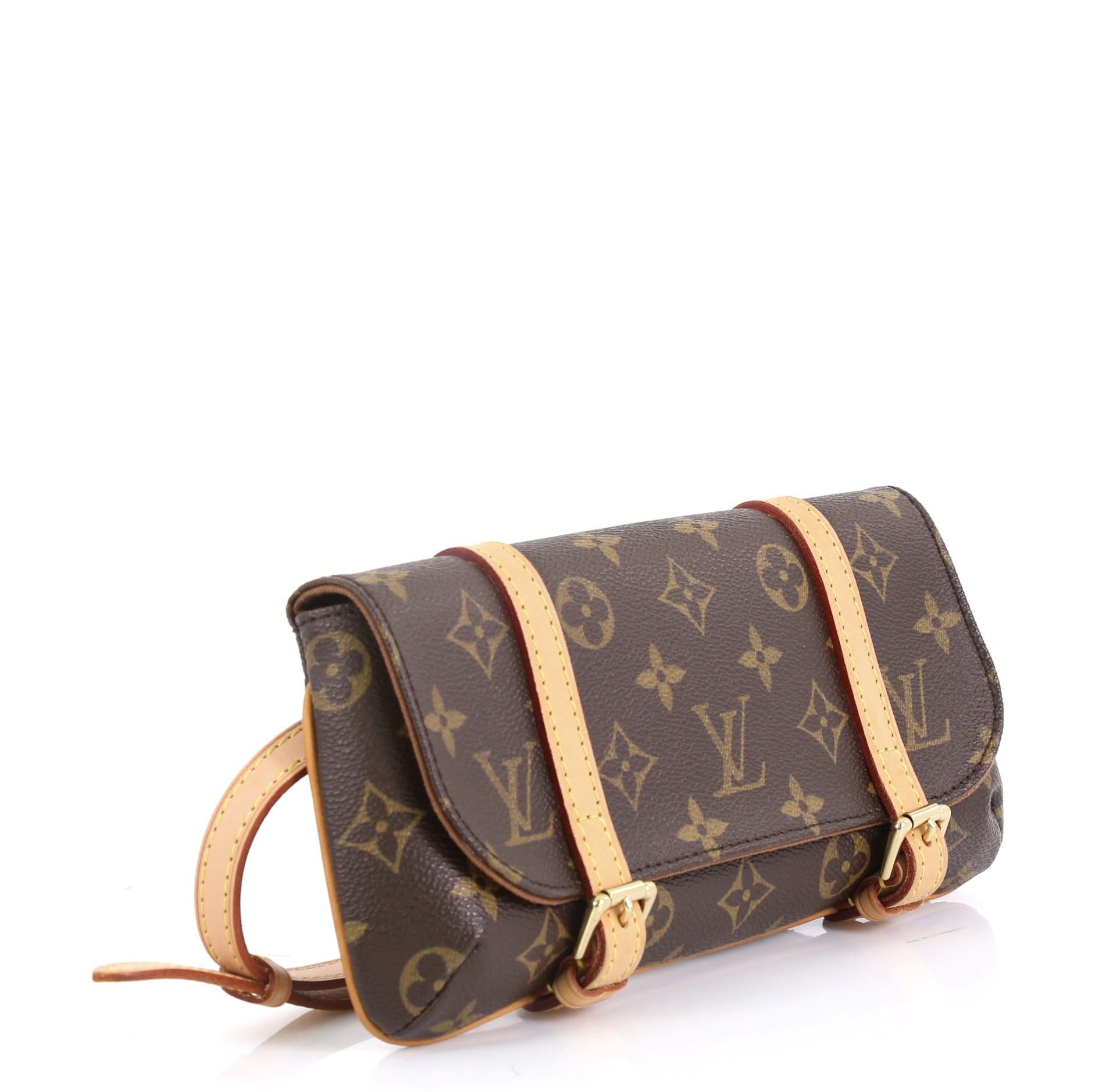 This Louis Vuitton Marelle Waist Bag Monogram Canvas, crafted from brown monogram coated canvas, features removable belt strap and gold-tone hardware. Its dual cowhide leather belt strap closure opens to a brown fabric interior with slip pocket.