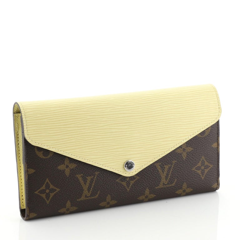 Sold at Auction: LOUIS VUITTON OANGE/ BROWN MARY LOU WALLET
