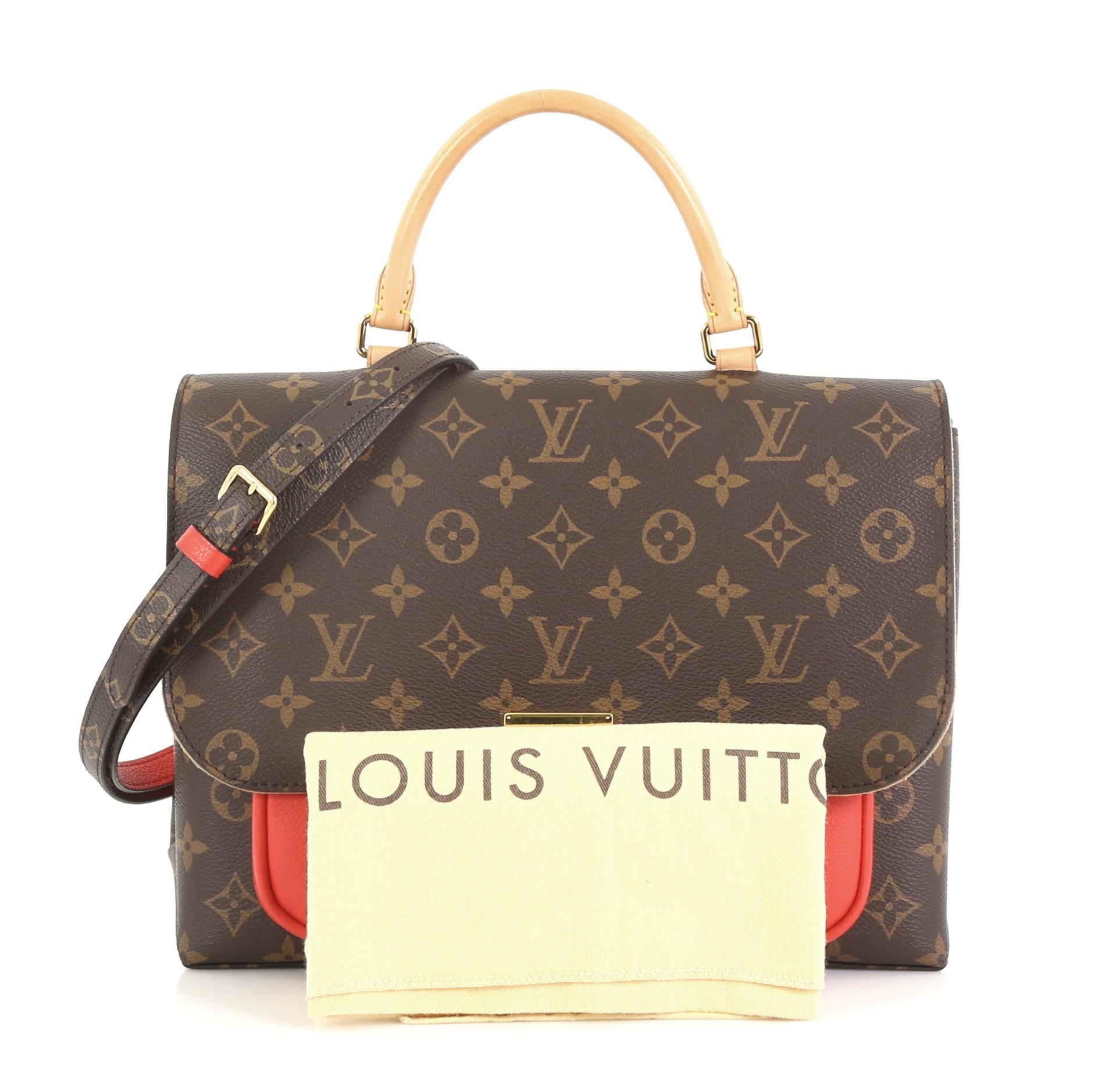 This Louis Vuitton Marignan Handbag Monogram Canvas with Leather, crafted in brown monogram coated canvas with red leather, features a rolled leather top handle, exterior flat pocket under flap, and gold-tone hardware. Its flap opens to a brown