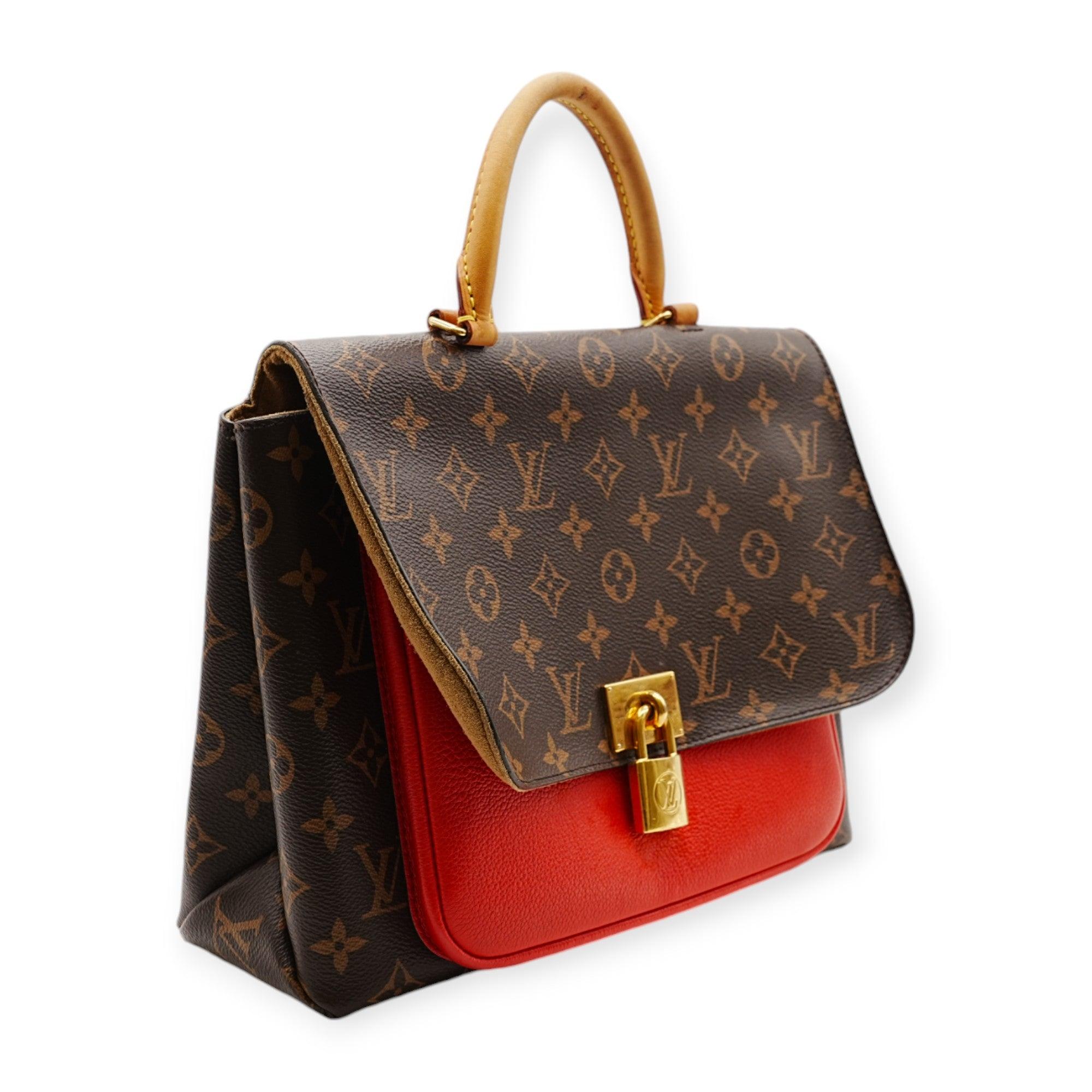 The Louis Vuitton Marignan Monogram Brown & Red Bag features the classic monogram design with bold red accents. A gold-tone key lock at the bag’s opening adds a touch of elegance and security, making it both stylish and functional. 
 Remarks: