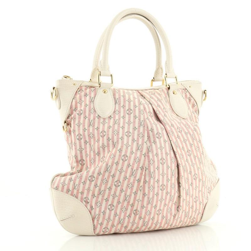 This Louis Vuitton Marina Handbag Mini Lin Croisette PM, crafted in neutral and pink mini lin canvas, features dual rolled leather handles, pleated silhouette, and gold-tone hardware. Its zip closure opens to a neutral fabric interior with slip