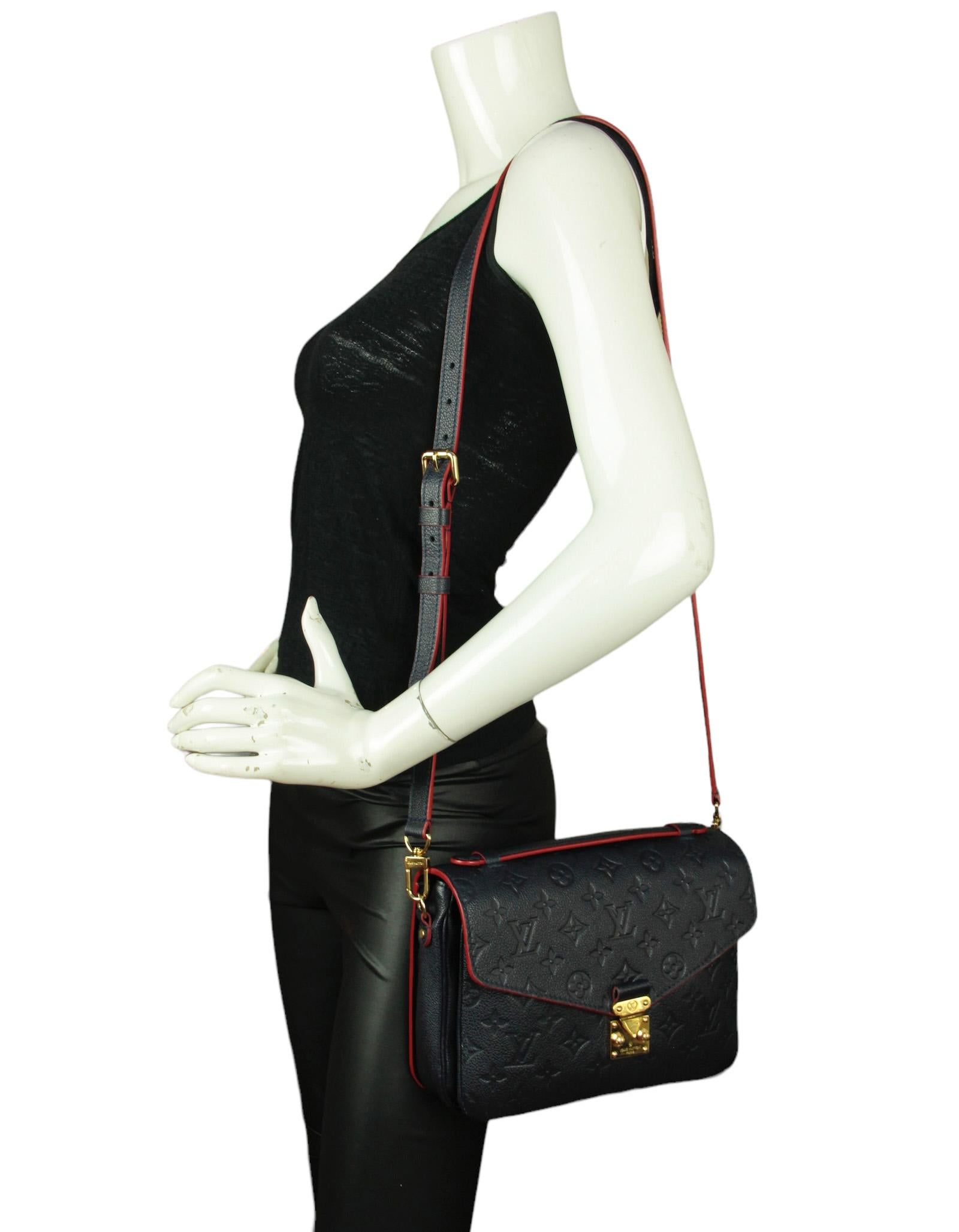 Louis Vuitton Marine/ Rouge Empreinte Pochette Metis Messenger Bag


Color: Blue with red trim
Hardware: Goldtone
Materials: Leather
Lining: Red printed fine textile
Closure/Opening: Flap top with s-lock
Exterior Pockets: Back zipper
Interior