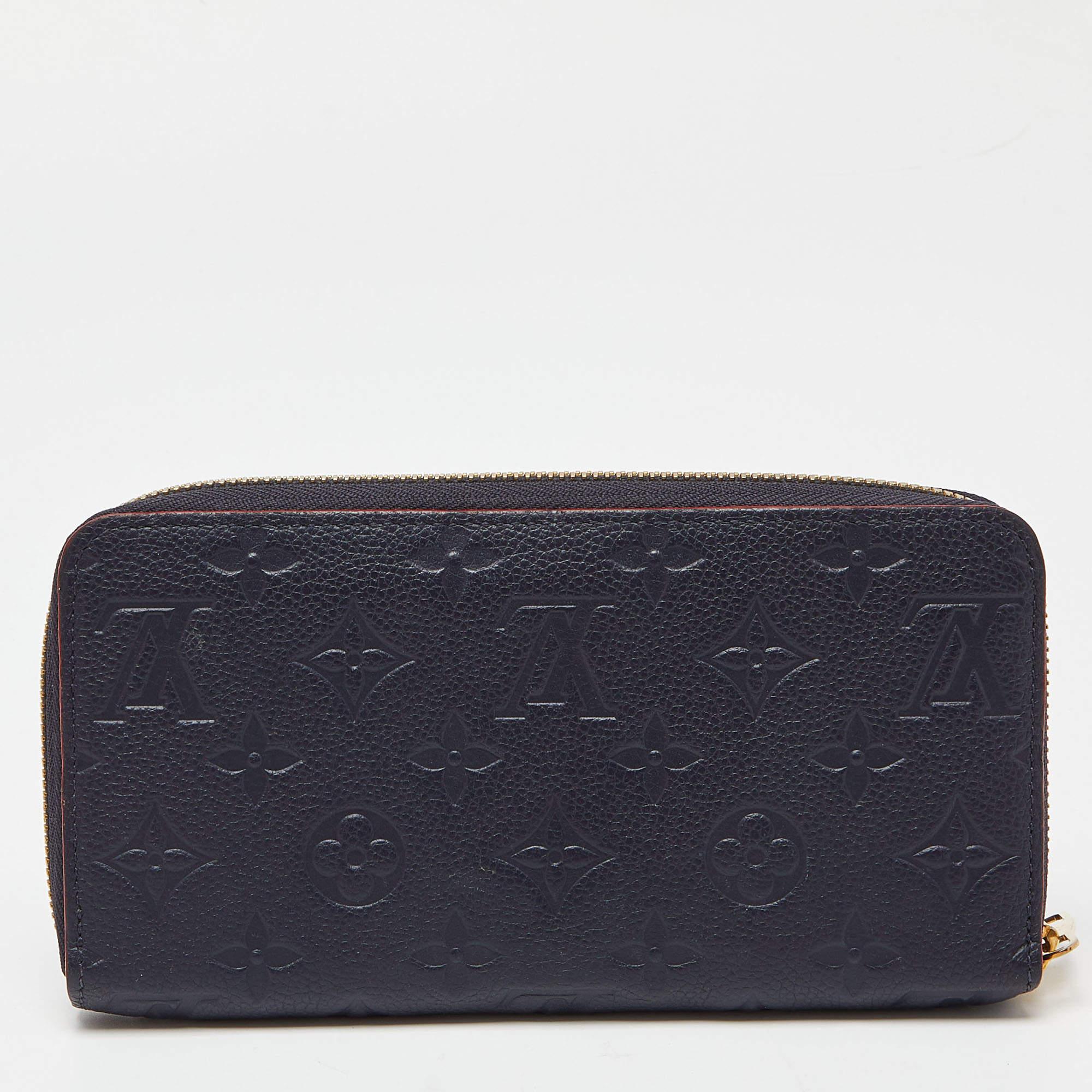 This Louis Vuitton Zippy wallet is conveniently designed for everyday use. Crafted from Monogram Empreint leather, the wallet has a wide zip closure that opens to reveal multiple slots, lined compartments, and a zip pocket for you to arrange your