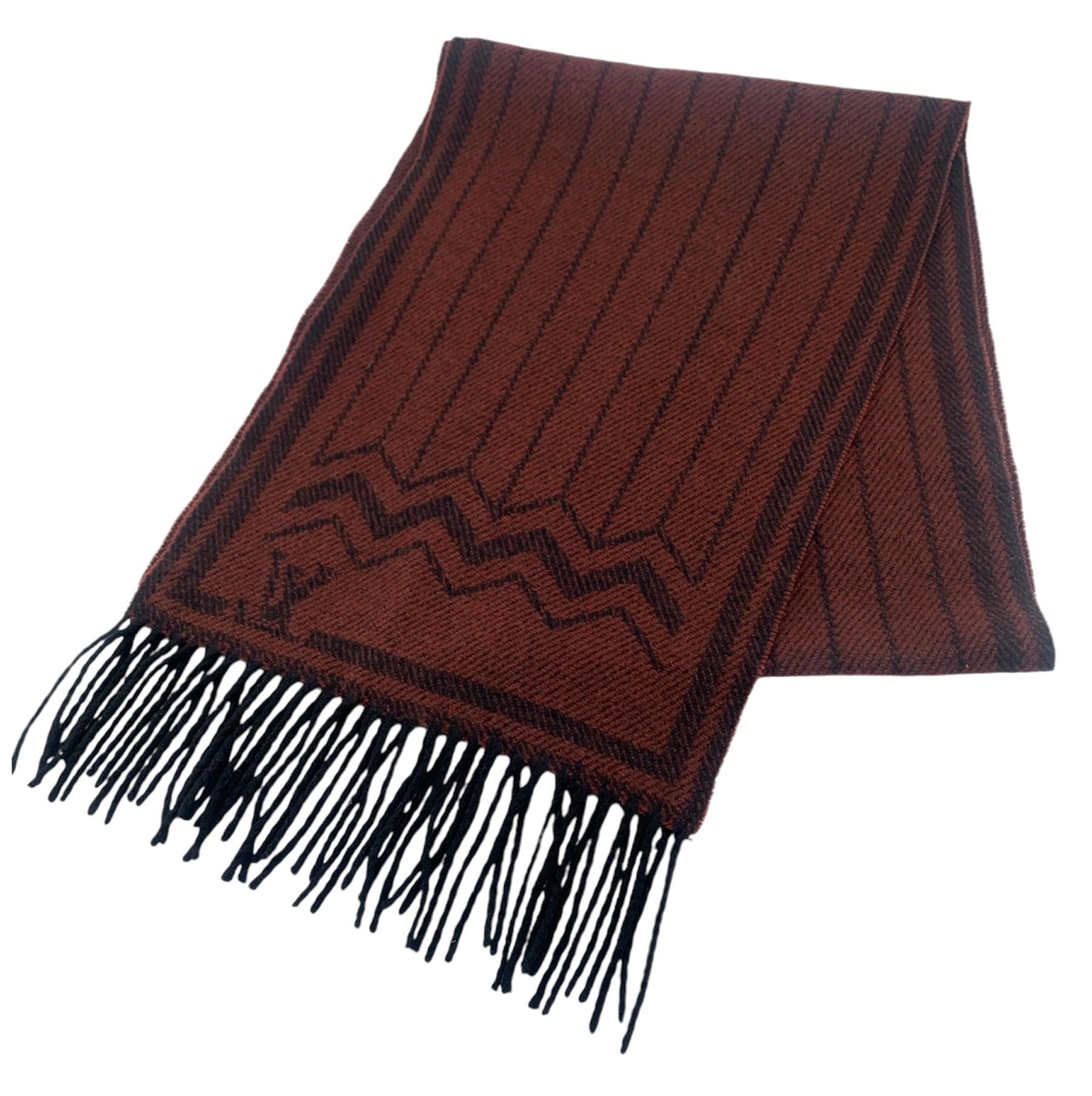 Luxurious Louis Vuitton maroon and black cashmere and wool blend knit scarf. The shades of maroon and black weave together to give a brownish look from afar. The scarf lends itself nicely to many winter color palettes. Perfect mid-weight scarf. Soft