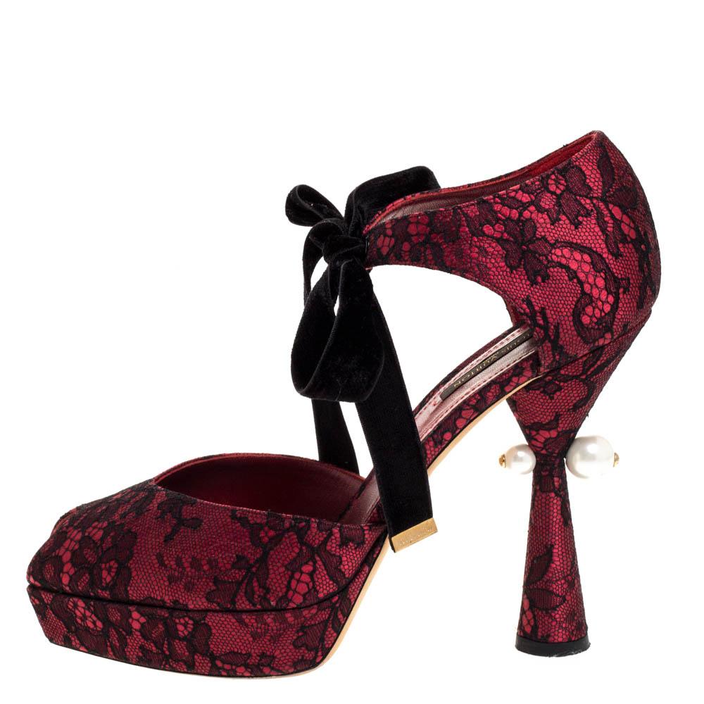 This pair of Louis Vuitton pumps is more than just a basic fashion statement. Showcase feminine elegance when you wear this pair of lace and satin pumps. These red pumps are designed with peep toes, velvet straps on the ankles and uniquely-designed,