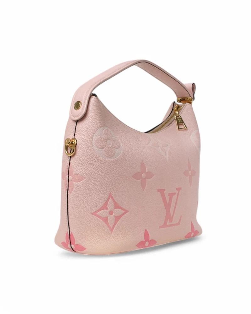 Louis Vuitton signature bag, Marshmallow model in PM size, made of empreinte leather with two-tone Giant monogram pattern and gold hardware. Featuring a top zipper closure, internally lined in tone-on-tone suede fabric with convenient pocket, the