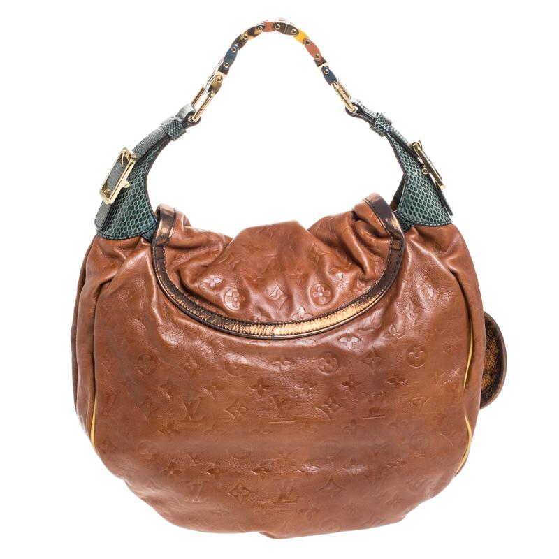 This Kalahari bag is a limited edition piece from Louis Vuitton's Spring/Summer collection. This stunning creation is named after the famous desert in Africa, the Kalahari. It is crafted from monogram-embossed leather and is accented with Ayers