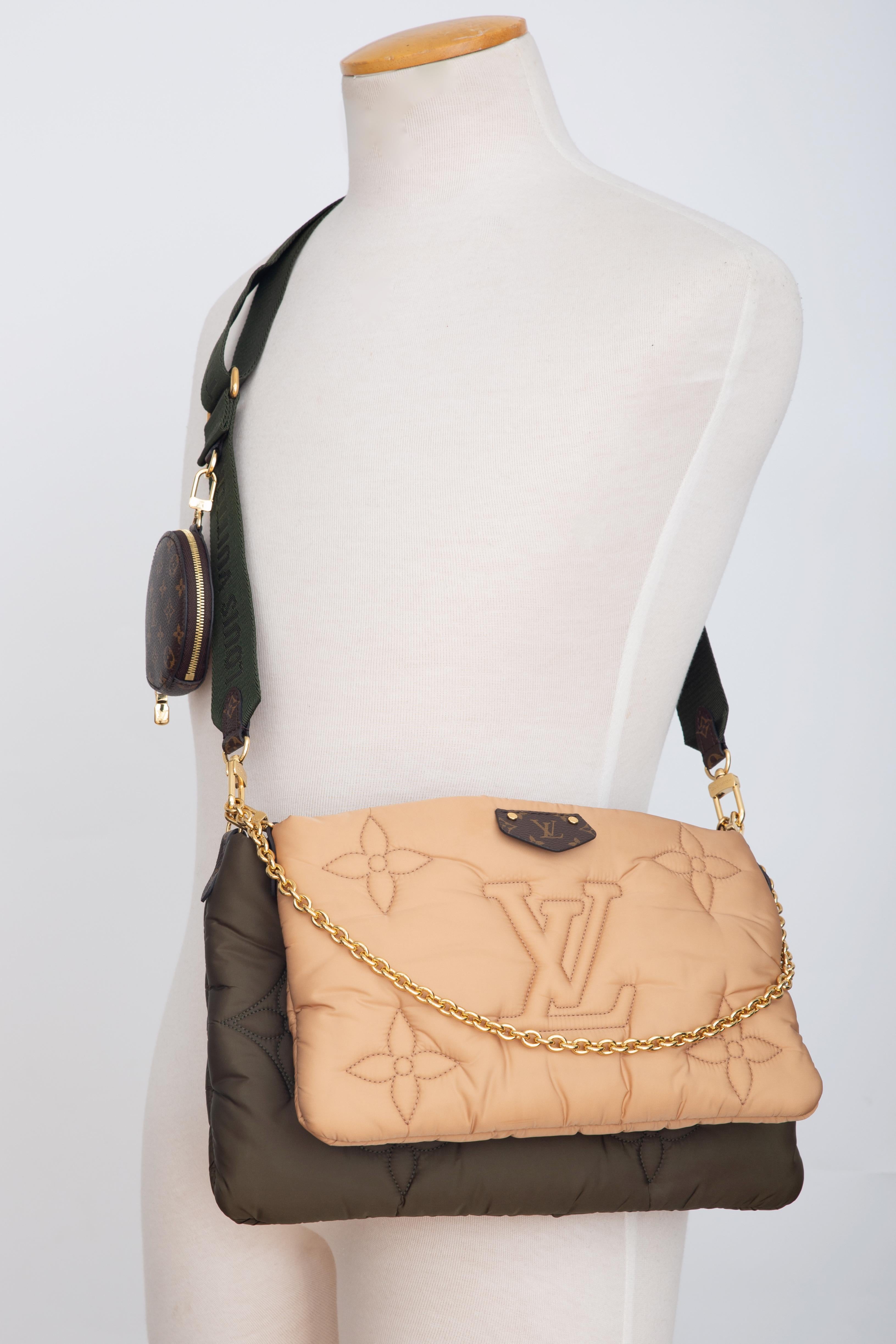The hybrid maxi multi pochette accessoires handbag comes in eco-responsible econyl regenerated nylon. The exterior is embroidered with a monogram pattern, giving it a comfy padded aspect, and lined with mini-monogram printed econyl. this cross-body