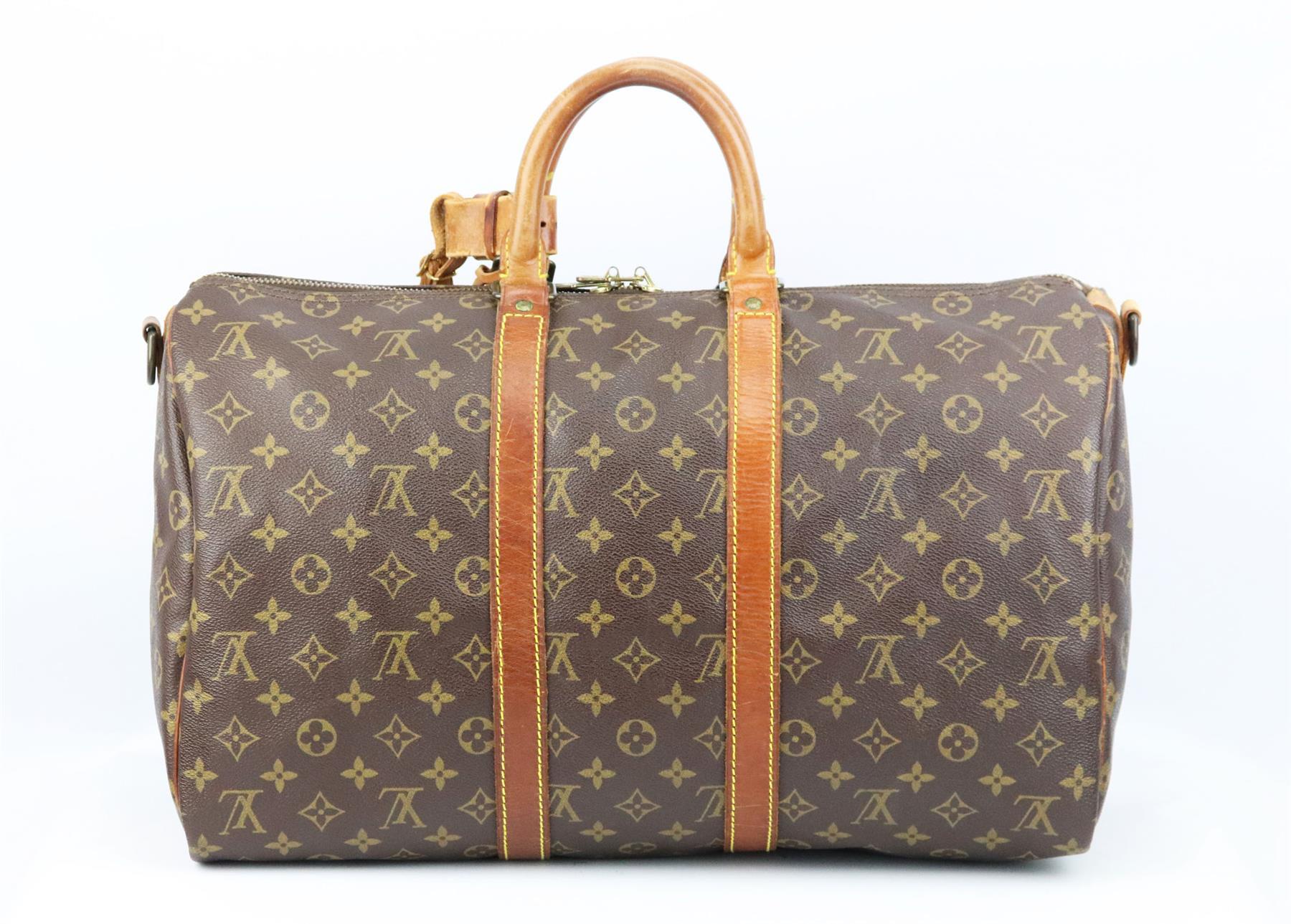 This ‘Keepall 45’ travel bag by Louis Vuitton is inspired by a classic duffle bag re-imagined and customised by Medium Mare, crafted from brown and beige monogrammed coated canvas and lined in blue canvas with brown leather handles and shoulder