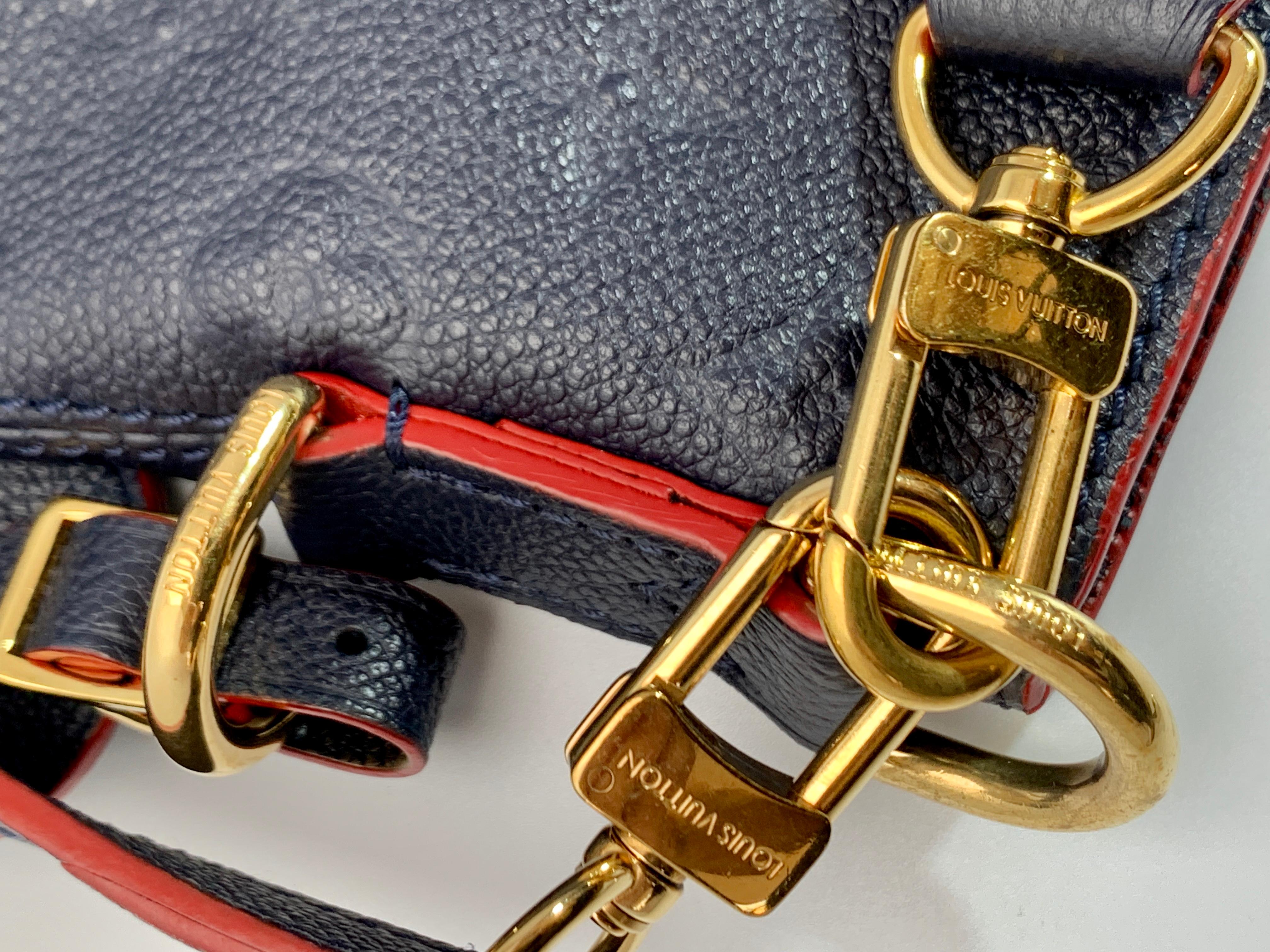 Sac hobo Melie Empreinte Louis Vuitton en cuir bleu marine avec monogramme, dans sa boîte 5