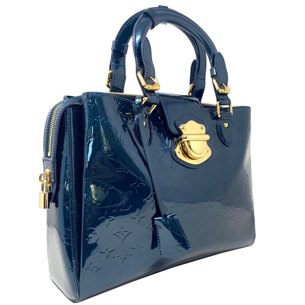 Company-Louis Vuitton 
Style-Melrose Avenue Blue Nuit  Patent Leather Handbag  
Outside -No rips, tears or stains
Inside-No Rips , tears or stains  
Pockets-Multiple compartments and pockets -Check pictures
Handles/ Straps-4