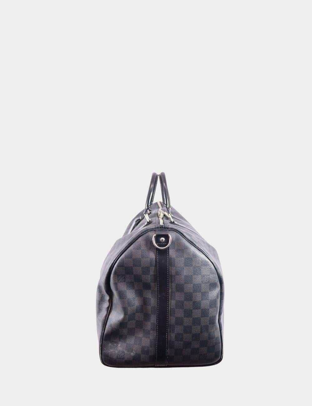 Louis Vuitton Men Keepall Bandoulière 55 Travel Bag, features signature Damier Graphite coated canvas, Double zip closure, Removable leather ID holder, Padlock, Cabin size, Removable, adjustable strap.

Material: Leather
Hardware: Silver
Height:
