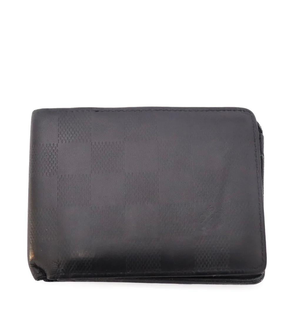 Louis Vuitton Men Multiple Wallet in embossed Damier Infini leather.  For Sale 1