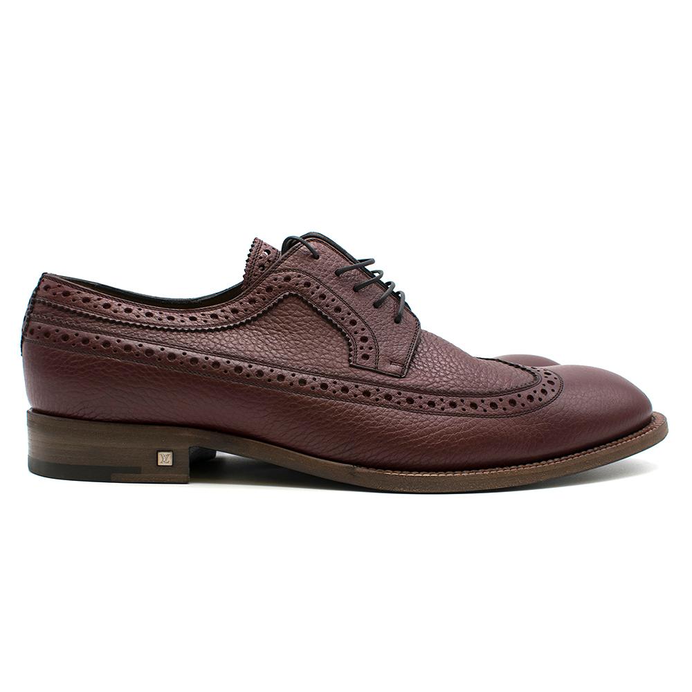 Louis Vuitton Burgundy Leather Brogue Shoes 

Burgundy leather brogue shoes for men,
Lace-up shoes with black laces,
Stitching and perforation design,
Stacked shoe heel,
Iconic Louis Vuitton logo on shoe heel 

Dust bag included. 

Please note,