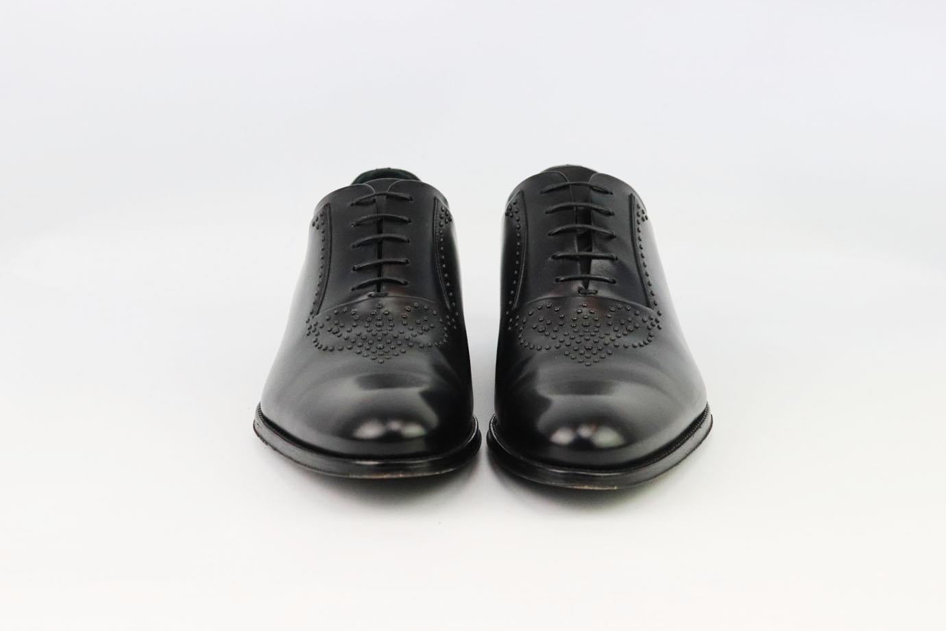 These Derby shoes by Louis Vuitton are hand-crafted to the highest specifications, the fine black leather and clean, sweeping lines create an unfailingly elegant appearance and finished with stud detail on the top. Sole measures approximately 25 mm/