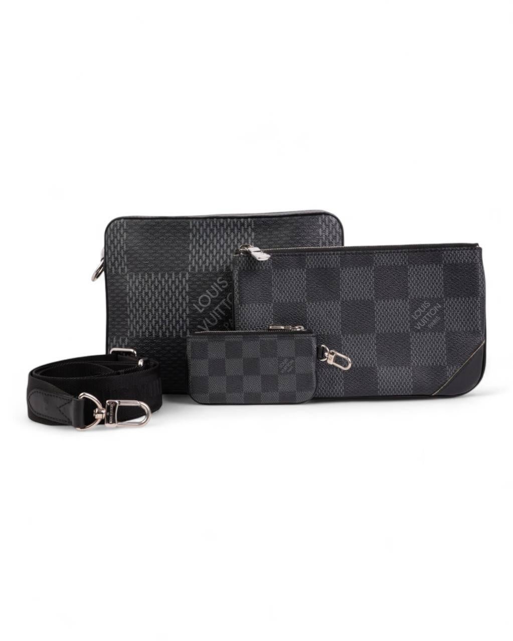 Louis Vuitton signature shoulder bag, Messenger Trio model, made of canvas in Damier Graphite pattern and silver hardware. The main Pochette is accompanied by a removable front pocket, both zippered, internally lined with black canvas, quite