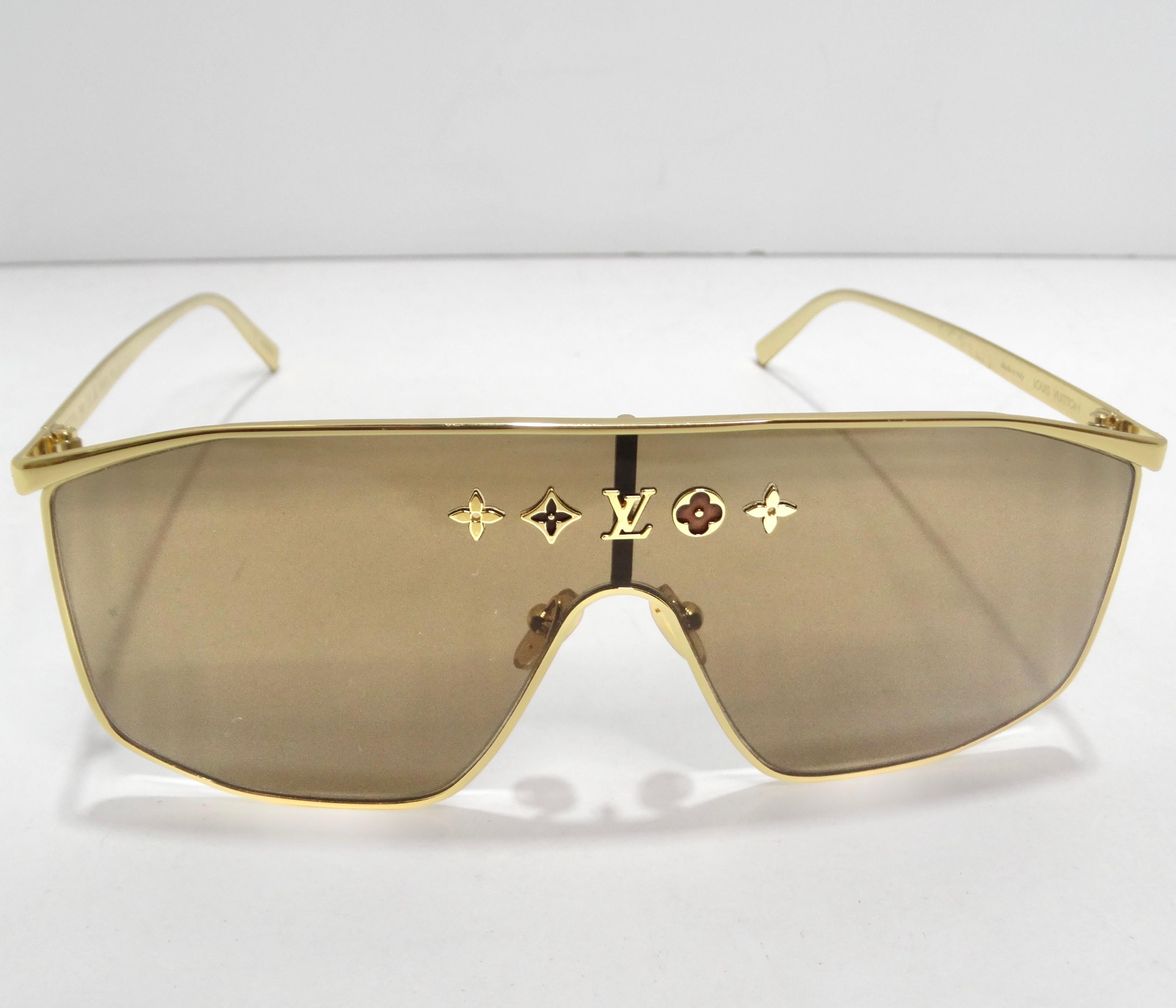 Introducing the Louis Vuitton Metal LV Golden Mask Sunglasses—an epitome of understated elegance and standout style. These sunglasses aren't just eye protection; they are a fashion statement that exudes luxury and sophistication. Picture yourself in