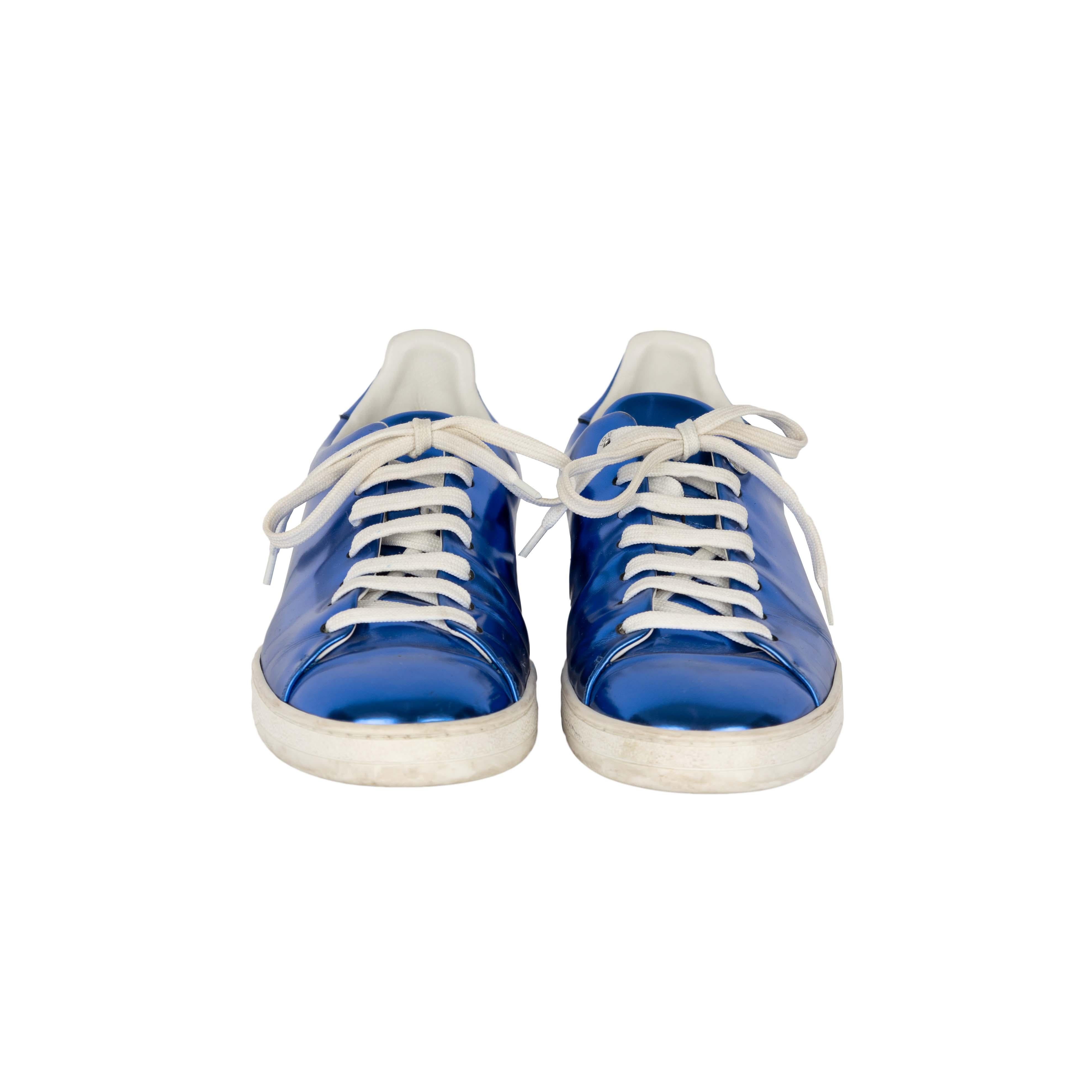 Shine through the crowd with these Louis Vuitton Metallic Blue Sneakers. The brand emblem attached to the side sole and the logo displayed on the bottom add to the branding flair of this made-in-Italy shoe.

Inclusion: dust bag

Insole Length -25
