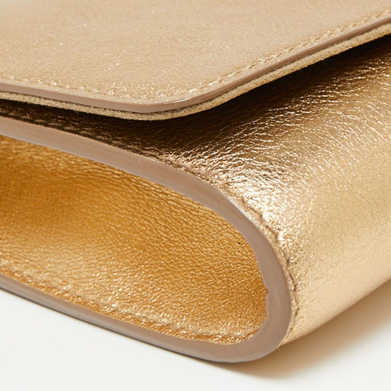 Louis Vuitton Gold Leather Louise Clutch at 1stDibs