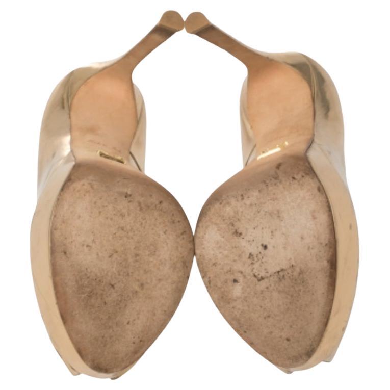 Known for their elegant and high fashion designs, Louis Vuitton never fails. Make a style statement while flaunting this timeless pair that has been made in Italy. Crafted from leather in a gold shade, they feature peep toes and slender heels
