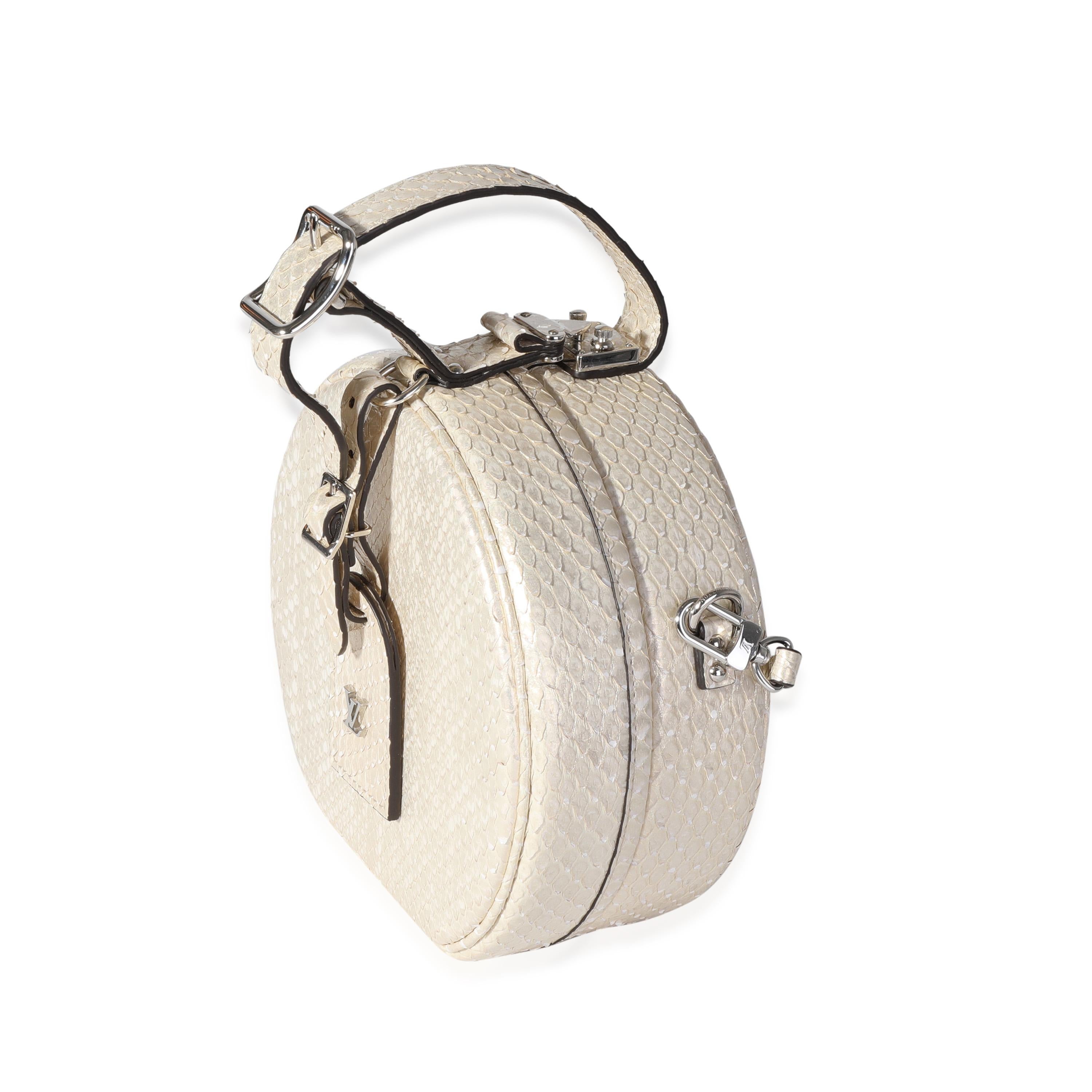 Listing Title: Louis Vuitton Metallic Gold Python Petite Boite Chapeau Bag
SKU: 119293
Condition: Pre-owned (3000)
Handbag Condition: Excellent
Condition Comments: Minor spots at interior lining. Please note: this item can not be shipped to all