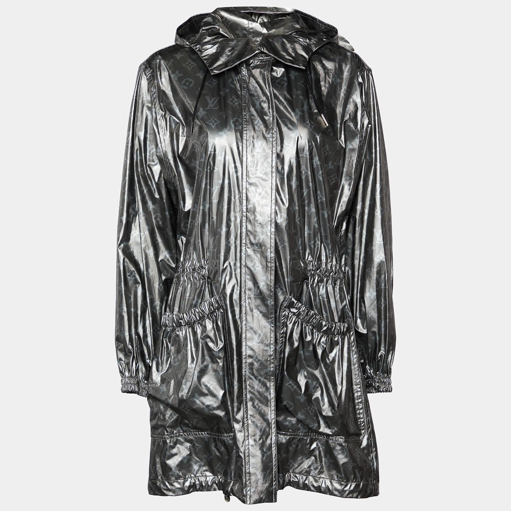 Made from coated modal fabric in a metallic grey shade, it features a zip front closure, a hood for added protection, and embodies a sleek and contemporary aesthetic with a touch of luxury.


