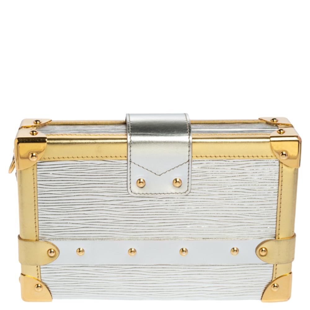 If you're looking for a bag with a blend of modern style and exquisite craftsmanship, this Louis Vuitton Petite Malle Bag is the answer. Crafted from metallic silver & gold Epi leather, it features armored corners, a strap flap with a logo-engraved