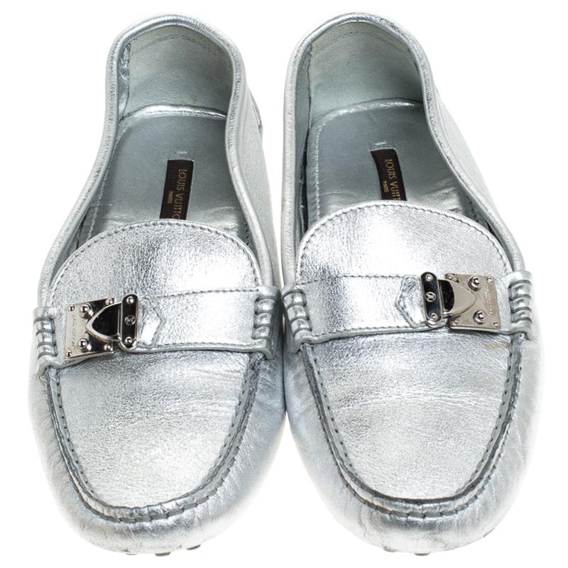 This pair of Louis Vuitton loafers combine comfort with style. Crafted from metallic silver leather, they feature comfortable insoles and the signature S lock on the uppers. A one-of-a-kind pair, it elevates every outfit it is paired with. The color