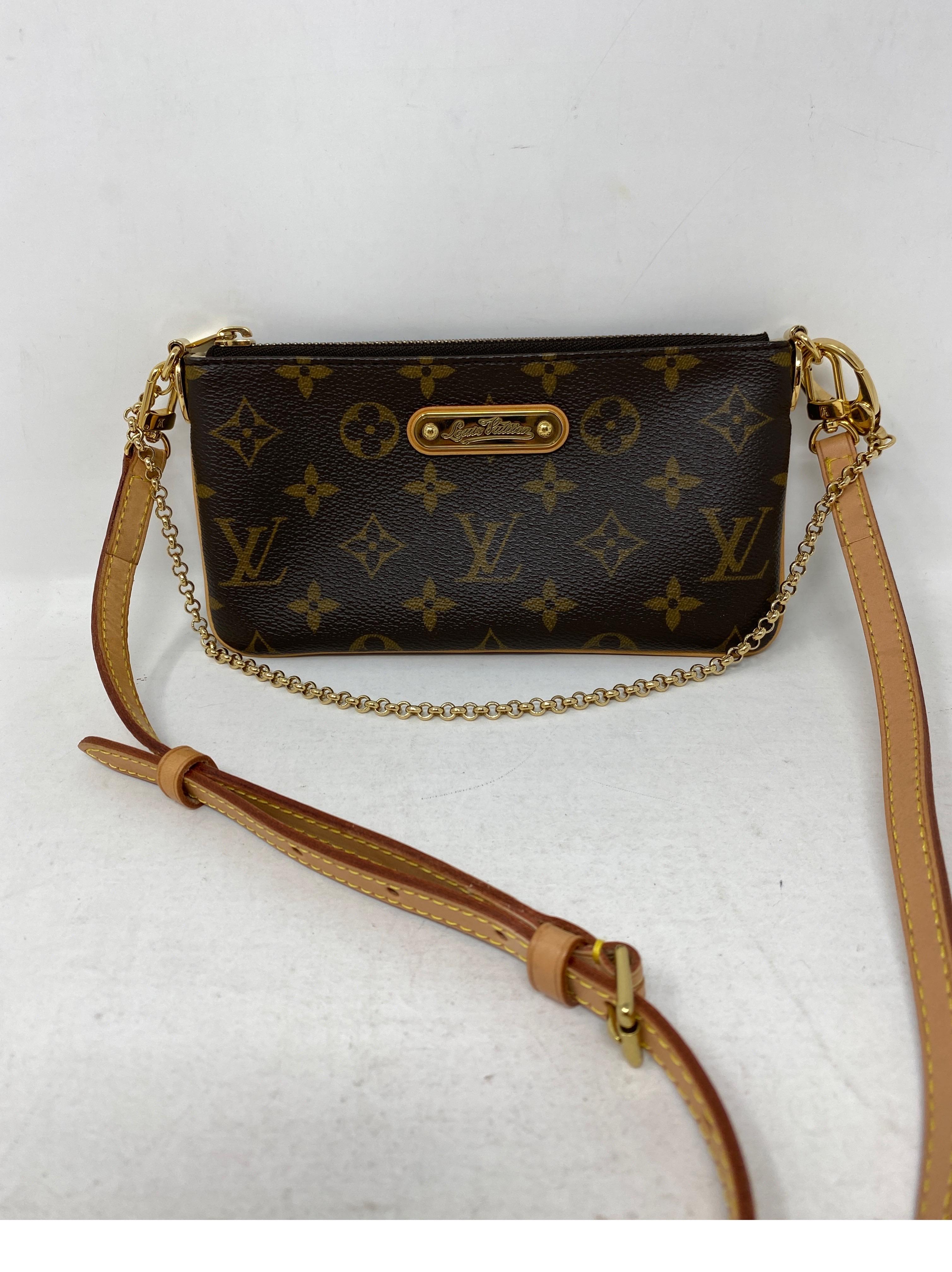 Louis Vuitton Milla Crossbody Bag. Retired style from LV. Mint like new condition. Can be worn as a clutch or as a crossbody. Guaranteed authentic. 