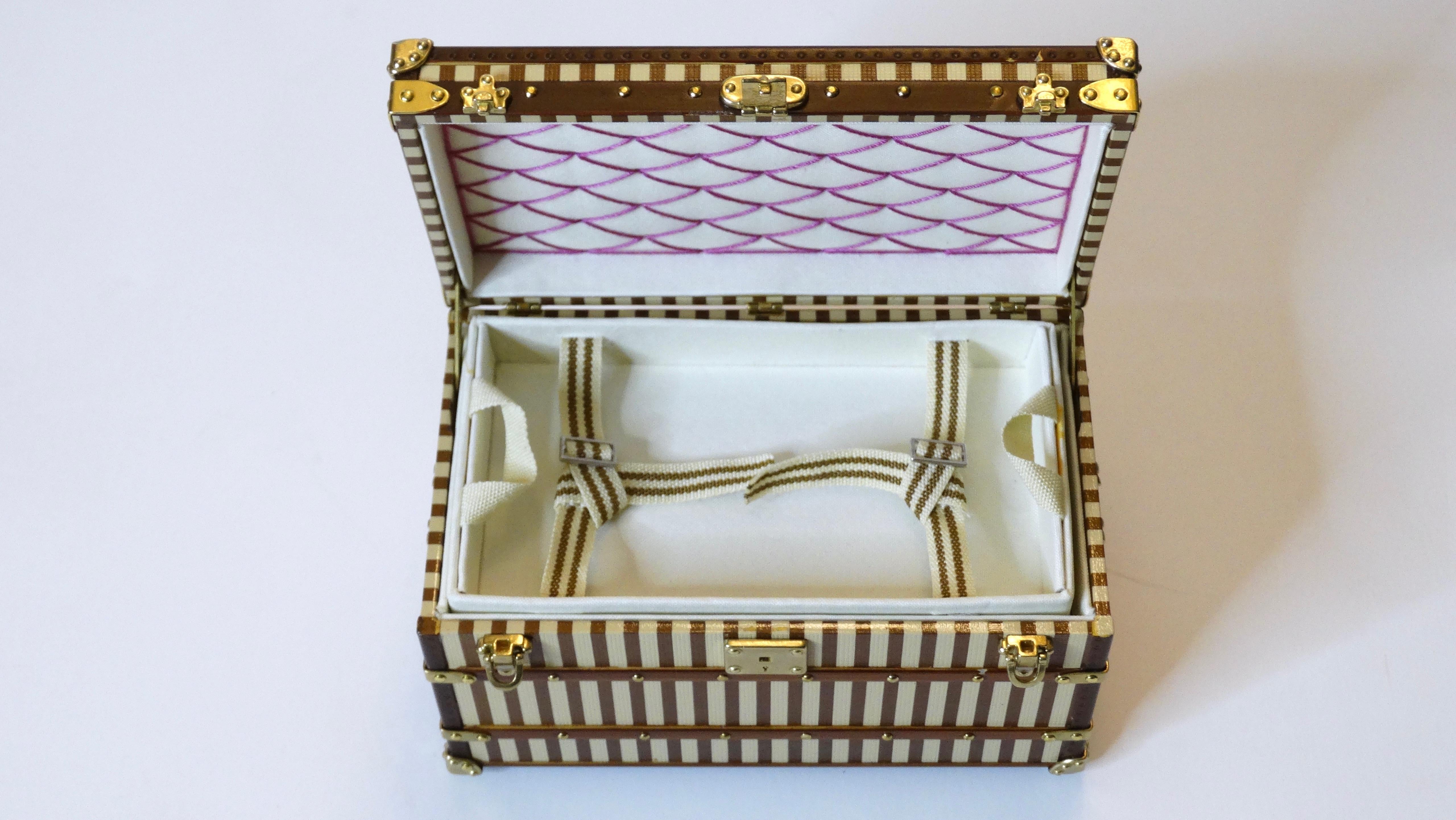 Vanity Alert, your vanity is missing this mini courrier trunk jewelry box from Louis Vuitton.  Created by Louis Vuitton as a VIP novelty gift. The mini courrier trunk is a 1/7 th replica of an original men's trunk from 1888 and sheathed in