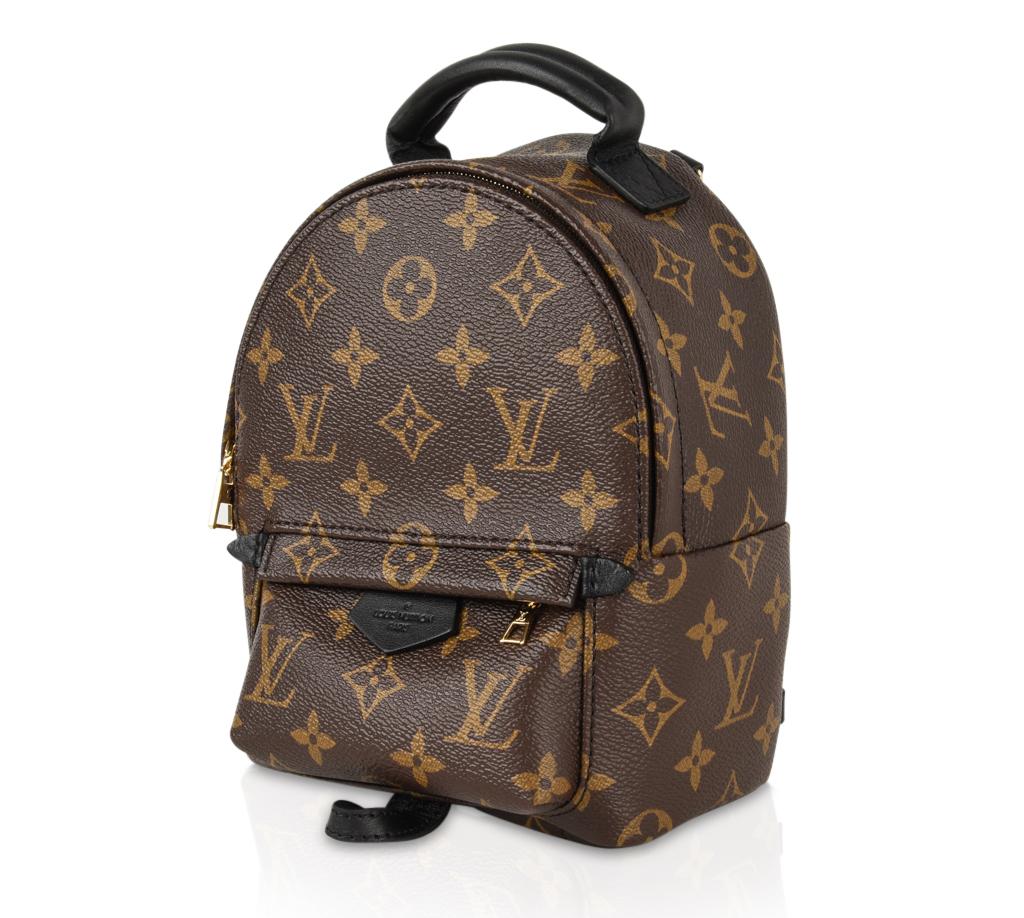 Guaranteed authentic Louis Vuitton signature monogram coated canvas Palm Springs mini backpack. 
Two adjustable shoulder straps.
Trimmed in calfskin with foam backing.
Leather scarf loop and leather top handle.
Front outside zip pocket.
Interior has