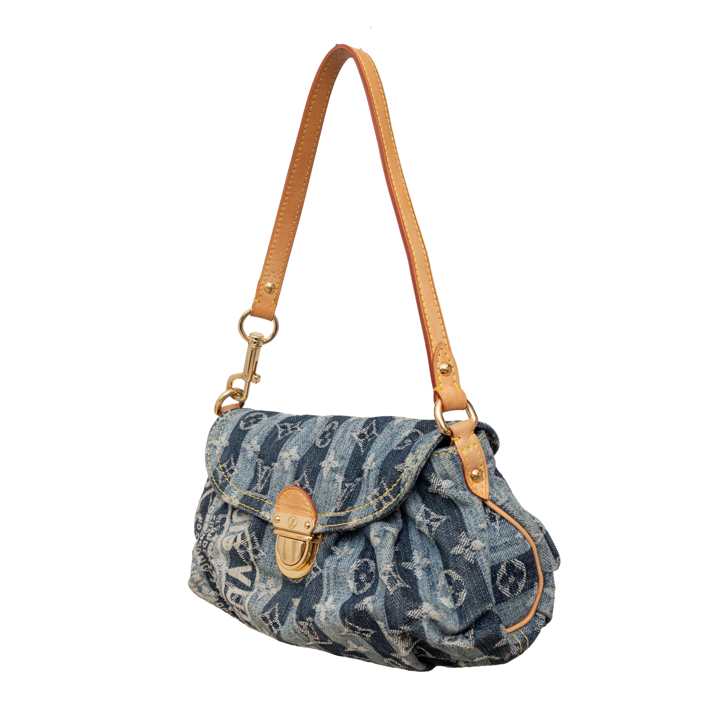 Introducing the limited edition Louis Vuitton Mini Pleaty Raye Bag, the stylish baguette crafted from fine striped denim and adorned with the iconic monogram print. With a beige leather shoulder strap, brass press lock, and orange suede interior,
