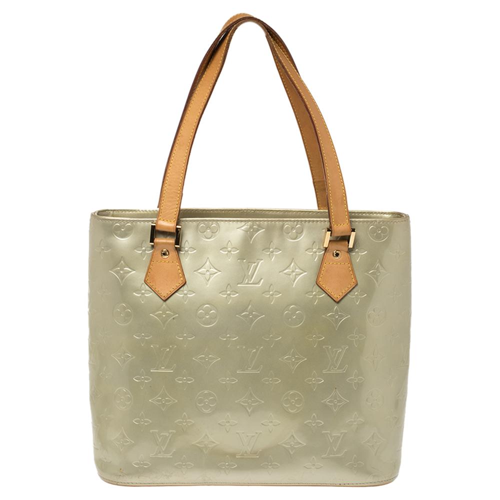 All of the handbags by Louis Vuitton are sought after by women around the world as they are all designed in a distinct style. This mint-green Houston tote, by Louis Vuitton, is a creation you should be proud to own. It has been crafted from Monogram