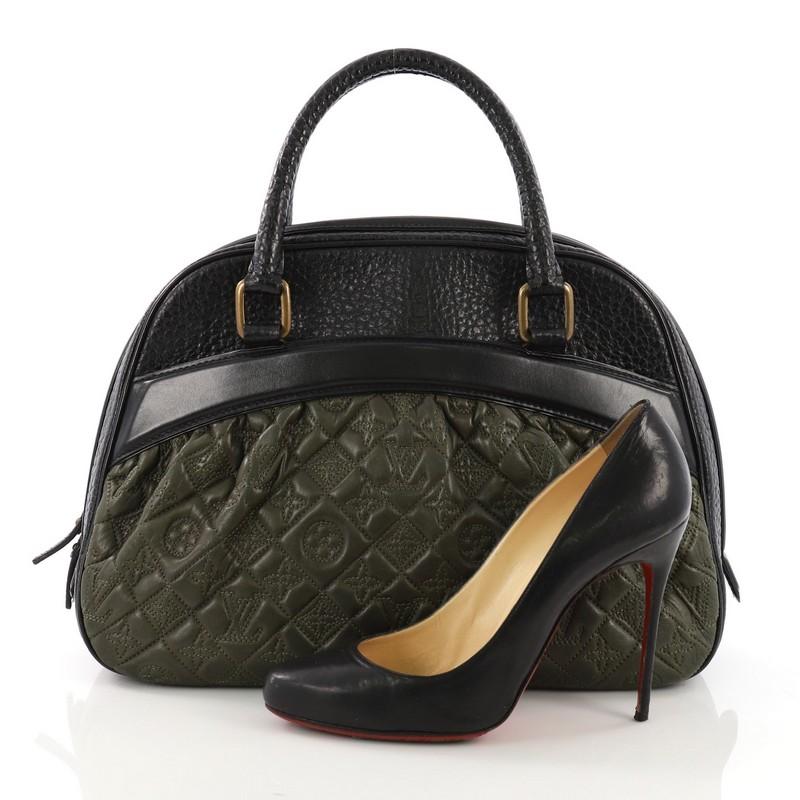This Louis Vuitton Mizi Vienna Handbag Monogram Quilted Lambskin, crafted from green and black monogram quilted lambskin, features dual rolled handles, exterior flat pocket, protective base studs, and gold-tone hardware. Its all-around zip closure