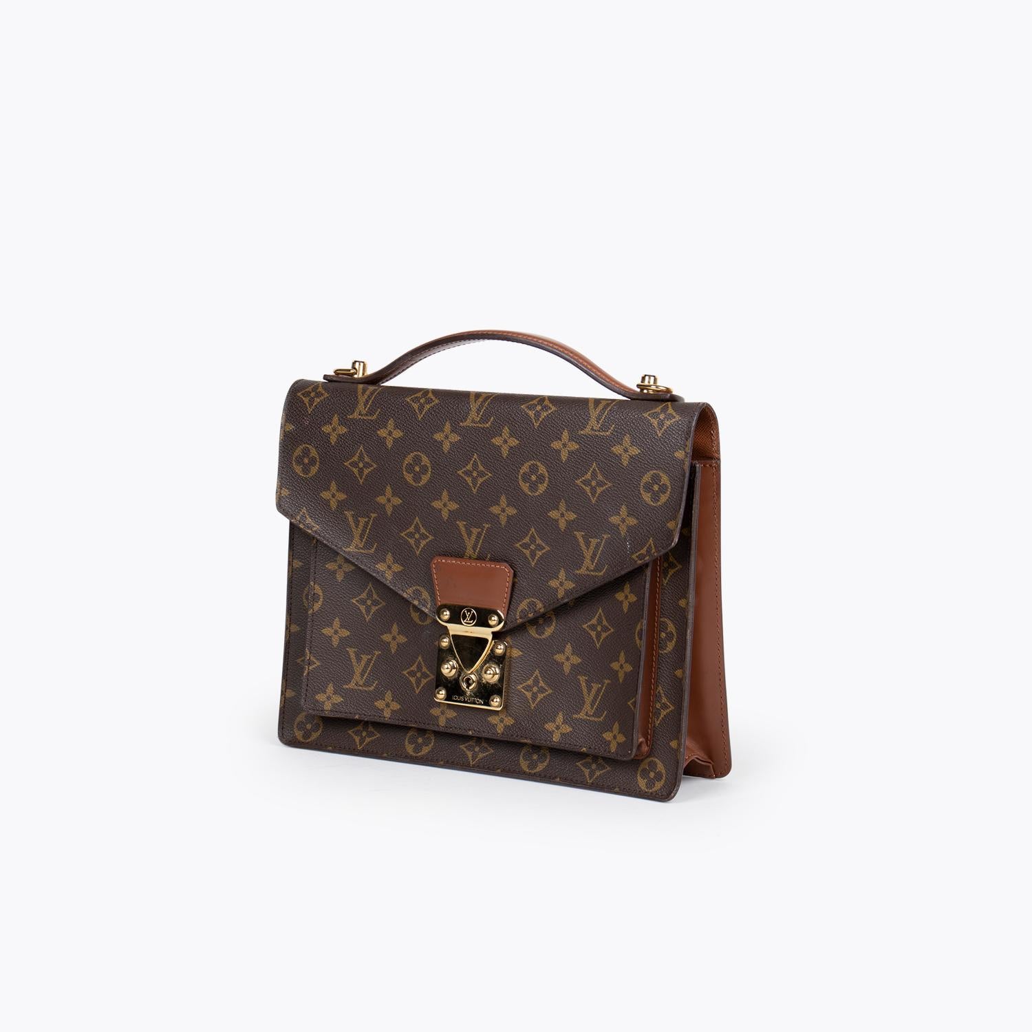 Brown and tan monogram coated canvas Louis Vuitton Monceau 28 with

– Brass hardware
– Brown vachetta trim
– Single flat top handle, single slit pocket under front flap, cinnamon Taiga leather interior, single interior zip pocket and S-lock closure
