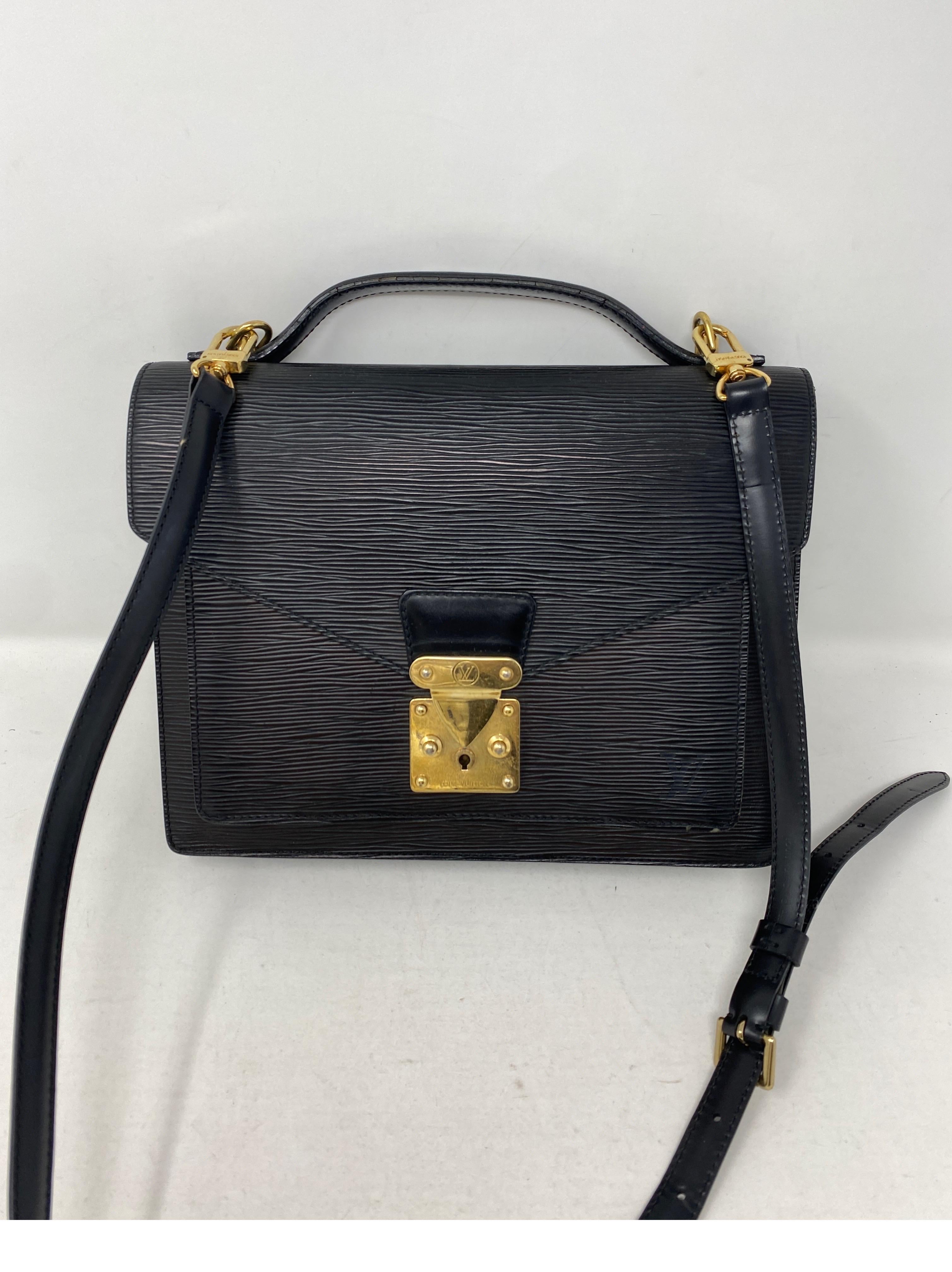 Louis Vuitton Monceau Epi Crossbody Bag. Black epi leather. Good condition. Gold hardware. Can be worn as a clutch or as a crossbody. Vintage retired style by LV. Guaranteed authentic. 