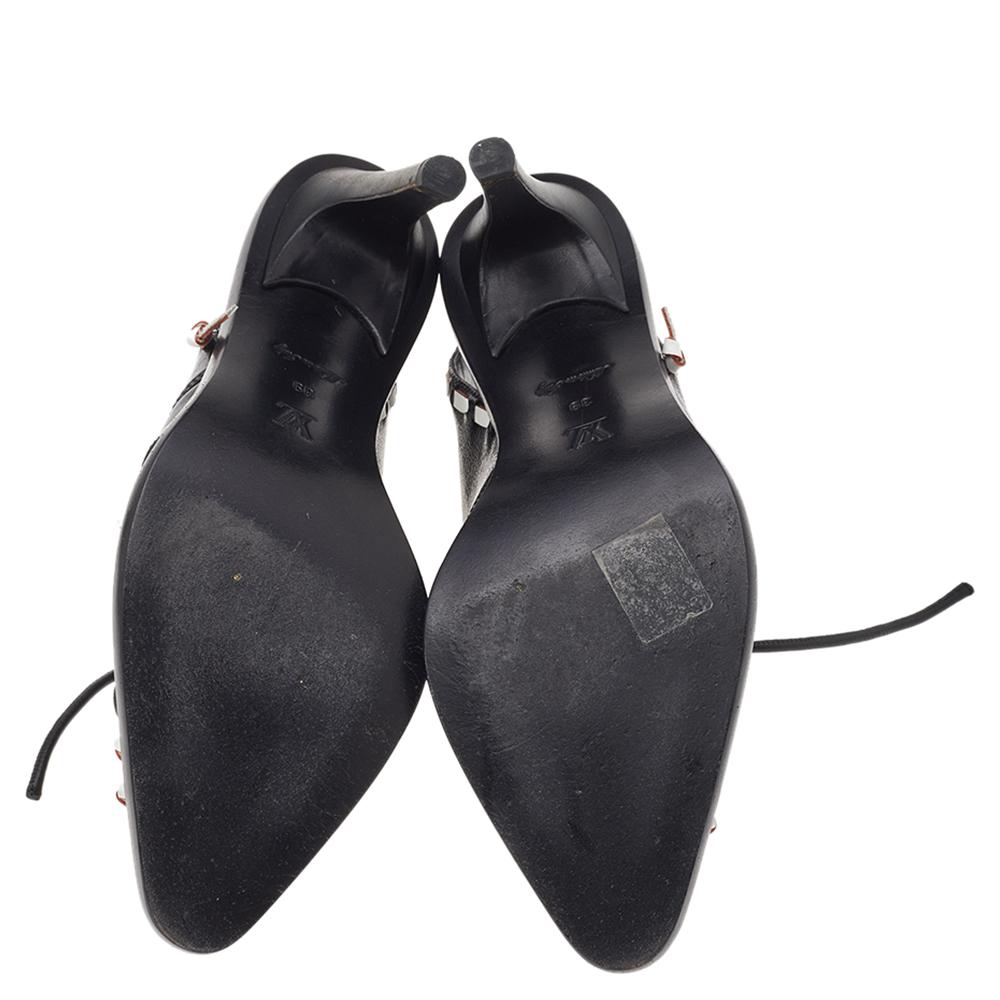 These Louis Vuitton booties are all you need to complete a rock-chic look. Crafted from leather, they feature contrast whipstitching, pointed toes, lace-ups, and high heels. Wear them both short hemlines and pants.

