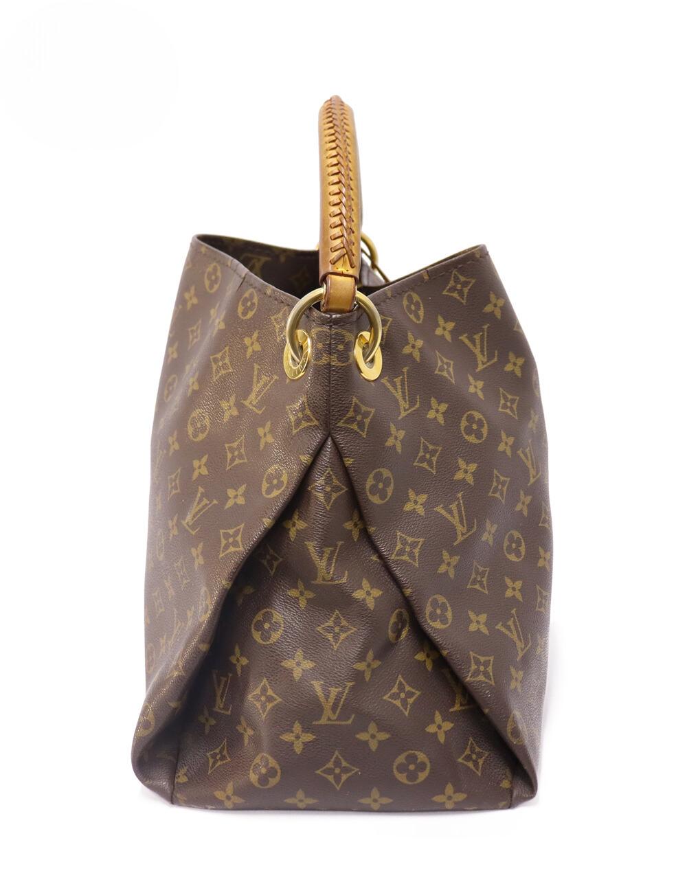 Louis Vuitton Monogram Artsy MM, Features cross-stitched top handle for shoulder, zip and slip pockets, and protective feet at base.

Material: Leather
Hardware: Gold
Height: 32cm
Width: 41.5cm
Depth: 19cm
Handle Drop: 15cm
Overall condition: